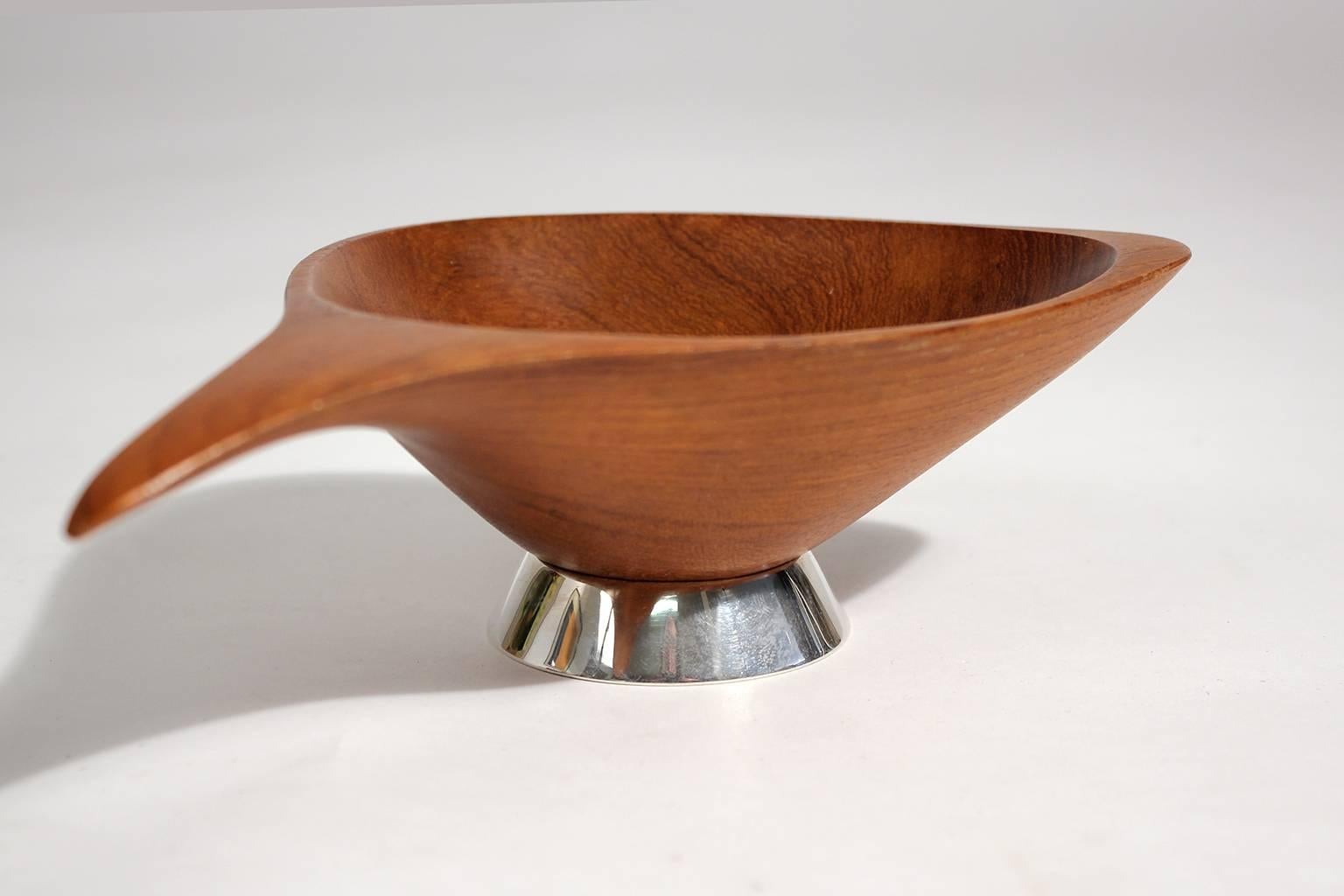 Excellent designed and handcrafted teak wood bowl by Emil Milan, circa 1960s. Great sculptural form and features an original solid sterling silver base. Great form and design. Signed on the bottom by the artist.