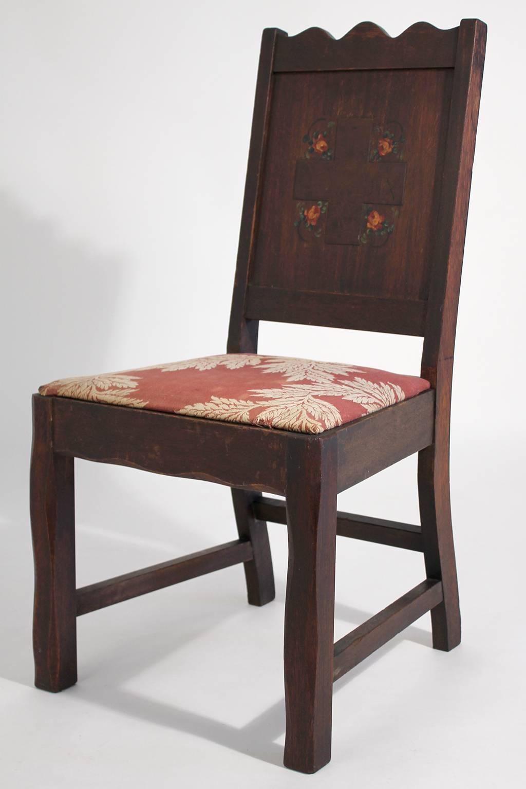 Tough to find original antique oak Arts & Crafts hand painted Monterey/Mission accent chair. I am pretty sure this was from a mission or church. Has an engraved cross on the back with hand painted floral accents. Made of solid oak. Has old