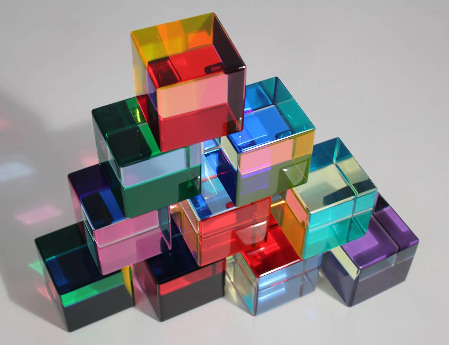 Beautiful set of ten Vasa Mihich acrylic cubes sculptures, circa 1990. Very limited edition of 50 and is number 18. Hand signed on one of the cubes. Color changes on each side of each cube. Can be arranged in many different ways. Very rare small