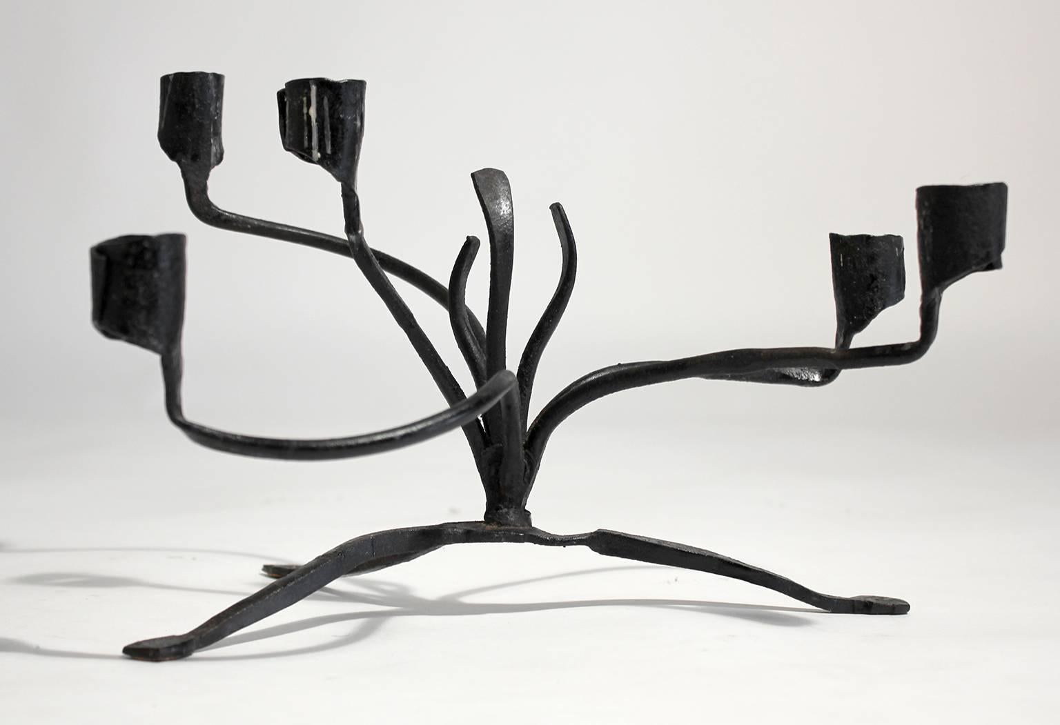 Unique sculptural Brutalist hang forged iron tabletop candelabra by renown California designer/craftsman C. Carl Jennings. Excellent vintage original condition with some residual wax and general age related wear from use. Signed.