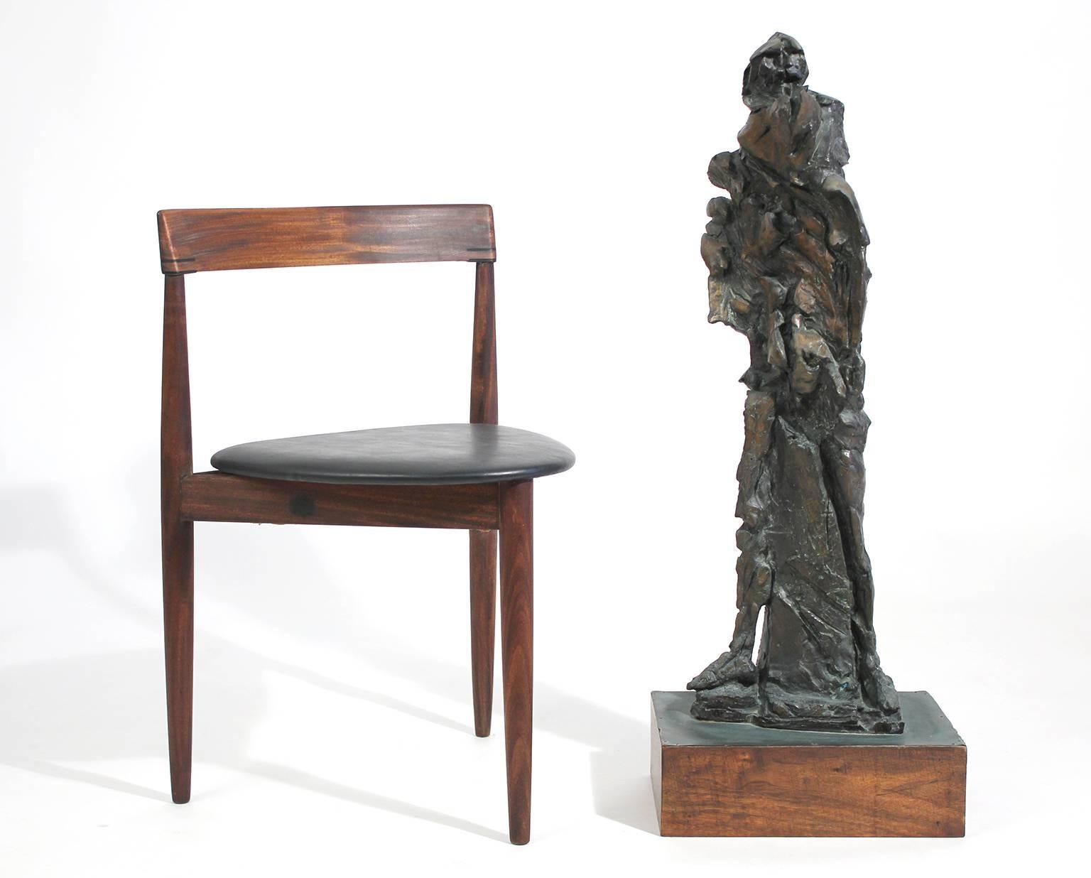 Large and very well executed cast bronze abstract Brutalist figural sculpture mounted on wood base with copper clad top. Artist unknown, circa 1960s.