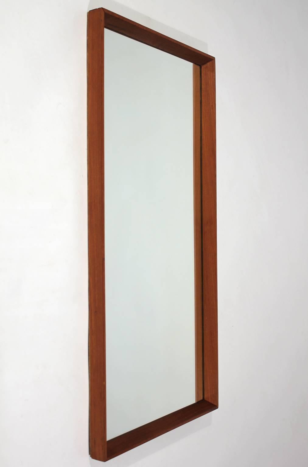 Beautiful modernist Danish teak mirror. Solid teak frame and in excellent condition.