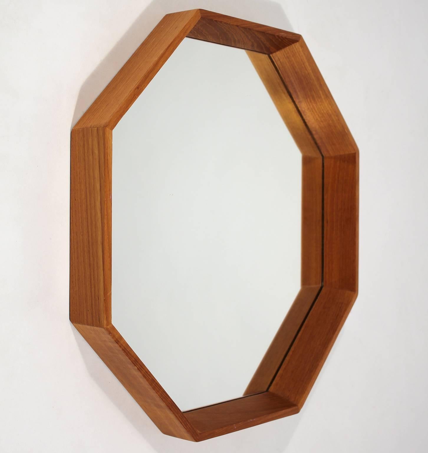 Great modernist Danish teak Octagon mirror designed by M.M. Spejle. In excellent shape with no issues. Mirror has no chips, no cracks and no scratches. Frame has been hand oiled and has wonderful grain and color.