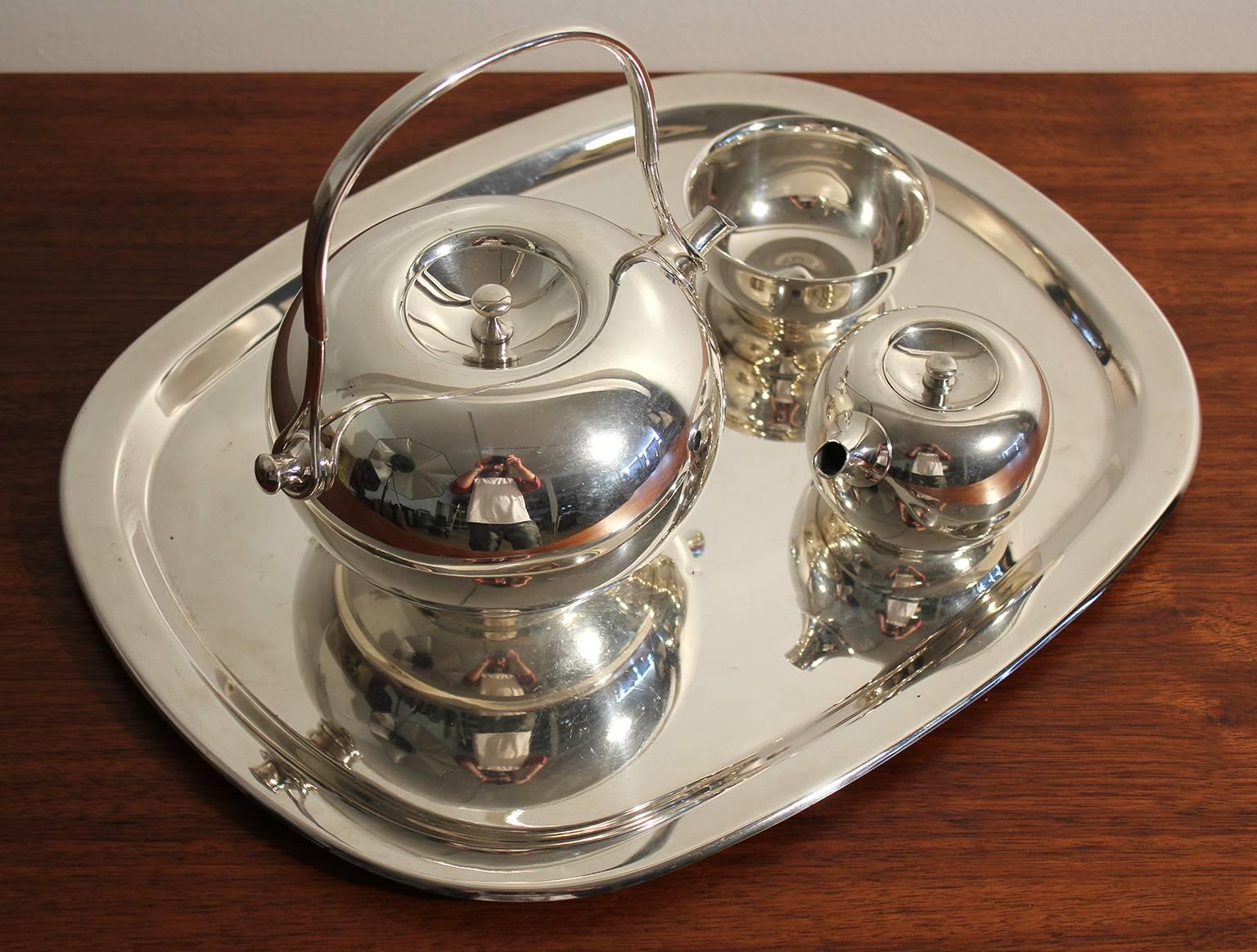 Beautiful modernist Dansk silver plate tea set designed by Vivianna Torun, circa 1960s. Comes with the tea pot, tray, creamer and sugar. Very rare to find complete. In excellent shape with no dents and the silver plate is in great shape.