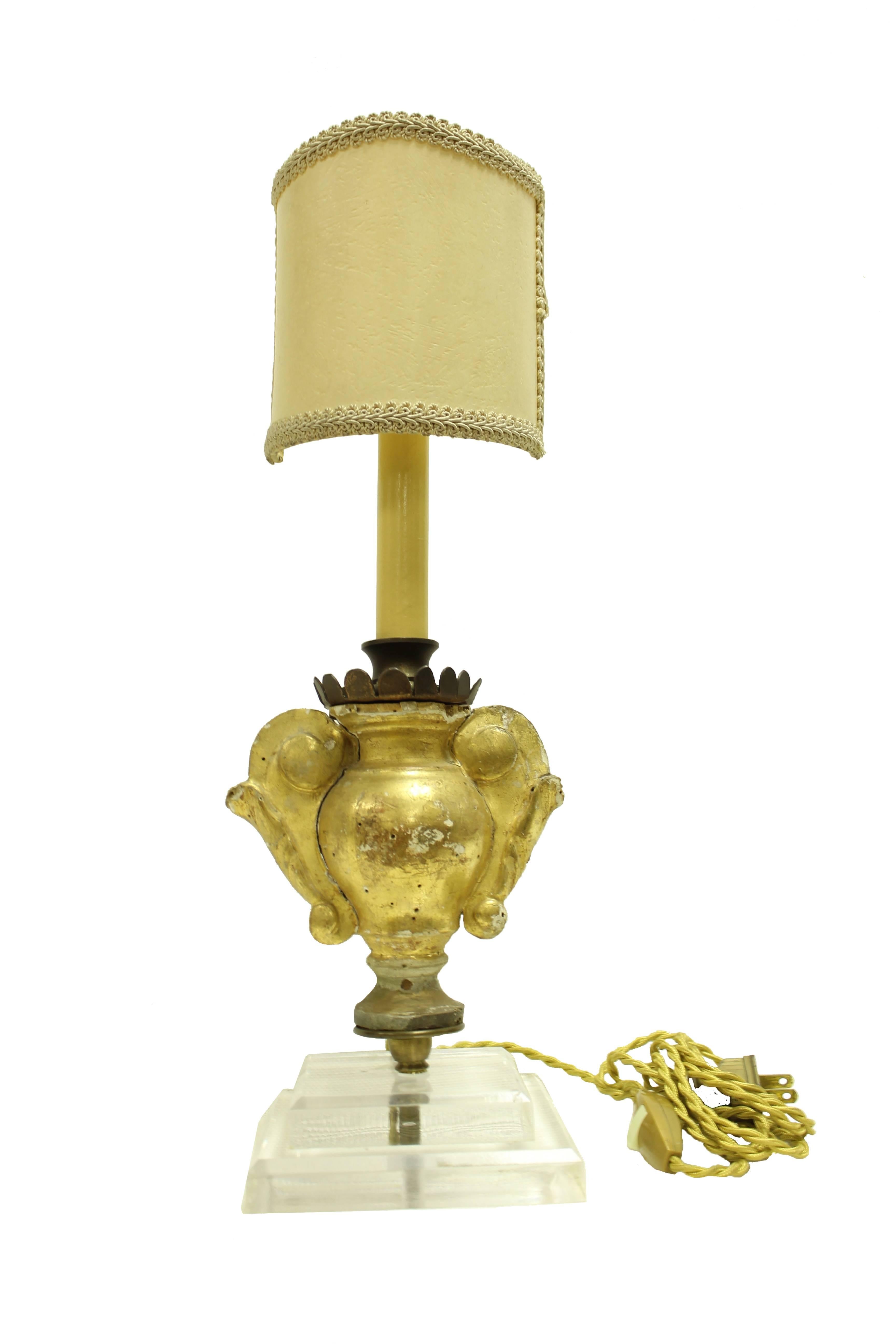 Pair of Italian 18c-19c Fragments Converted to Lamps with Acrylic Base. Beautiful gilded wooden fragments converted into lamps on acrylic bases. French wiring and small shield shades included. Acrylic adds a modern touch to these repurposed