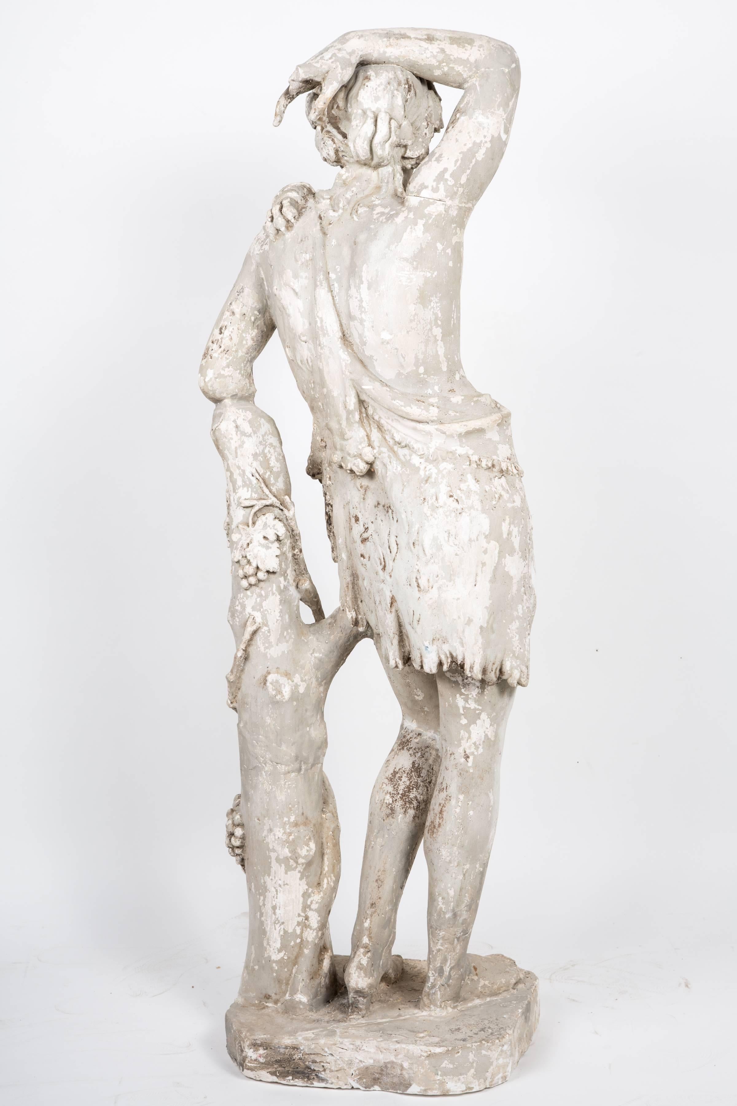 A modification of the Apollo Sauroktonos by Praxiteles of Athens (mid-4th century BCE), this statue has been altered to indicate a young Dionysus through the symbolic depiction of a draped panther skin, ivy in his hair, and grapes adorning the tree