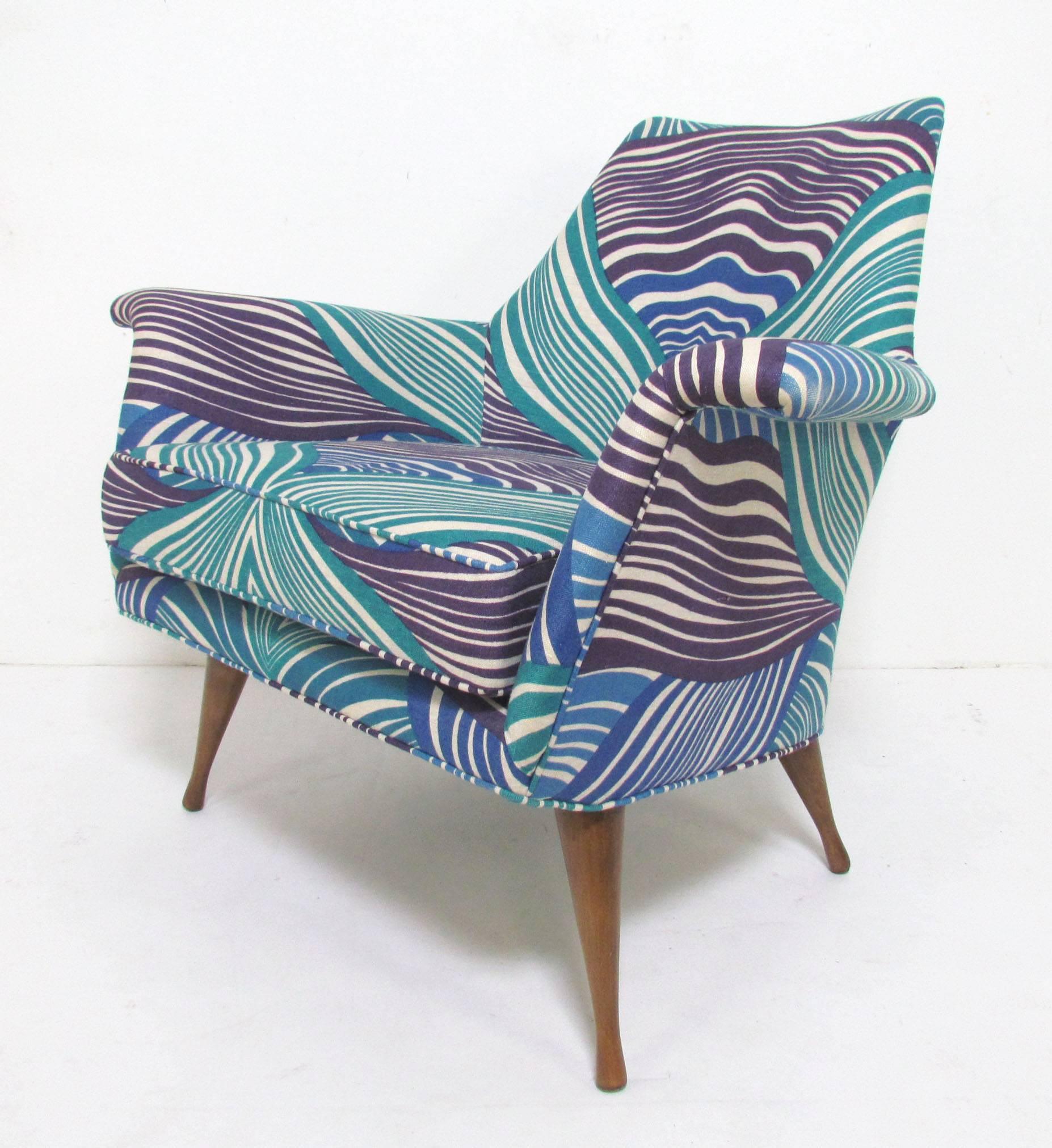 Rare model lounge chair with flared arms by Paul McCobb for the Widdicomb Symmetric Group, circa 1960s. Re-upholstered in vintage screen printed fabric within the past 10 years.