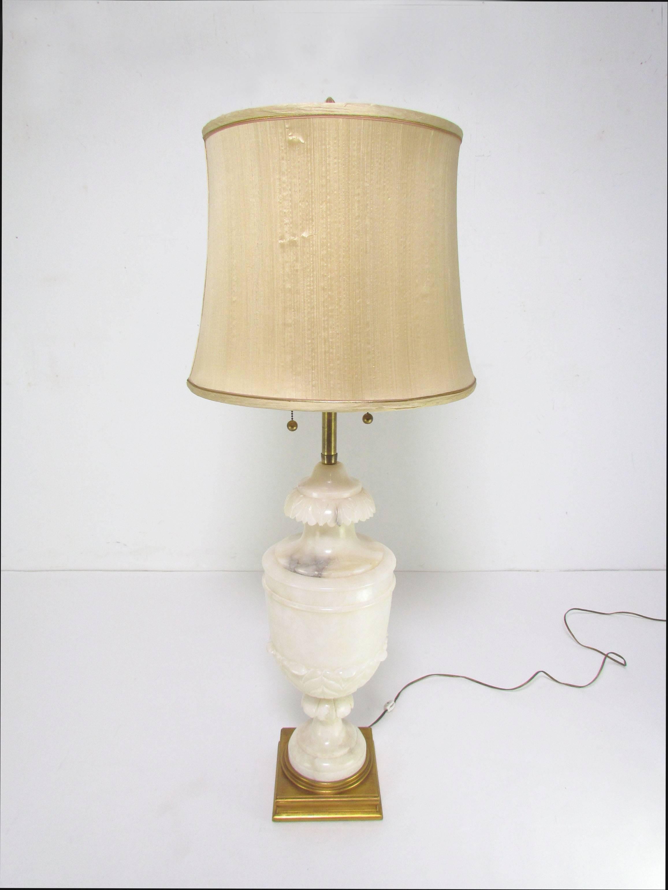 Large and impressive center-piece table lamp by Marbro Lamp Co. in carved alabaster, with gilt base, circa 1950s.

48