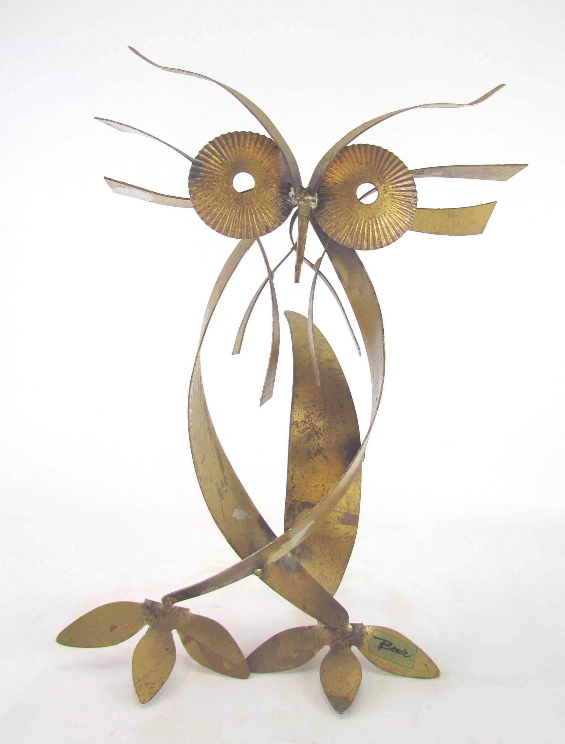 Metal work owl figure by renowned sculptor William Bowie, circa 1970s. Steel sheet with applied gold and silver foil leafing. 

William Bowie was active at the same time as the popular Curtis Jere Studio which produced its various abstract and
