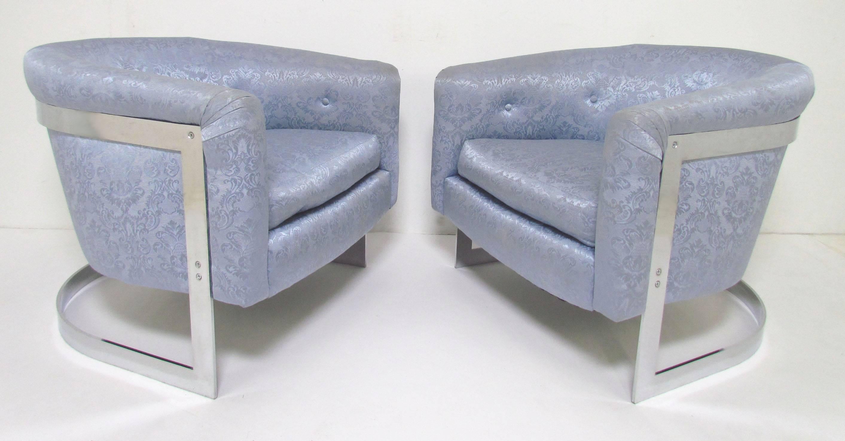 Pair of barrel form cantilevered lounge chairs in chromed steel, attributed to Milo Baughman, circa 1970s.