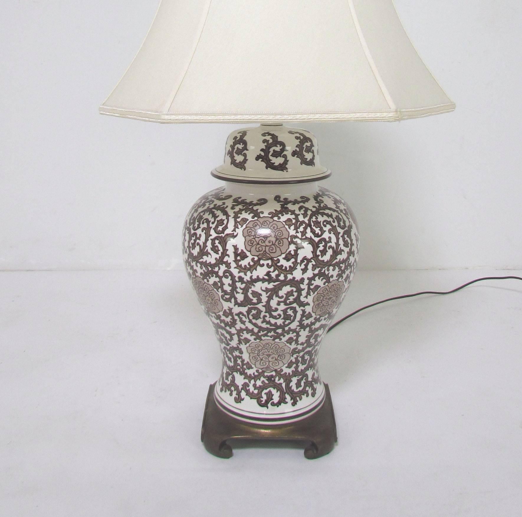 Lovely pair of ginger jar lamps with brass bases, custom silk shades by Roseart and Waterford Crystal seahorse finials.

Lamps measure 34" high to tops of finials, 9" diameter.
Shades measure 13.25" high, 20.25" x 17.5".