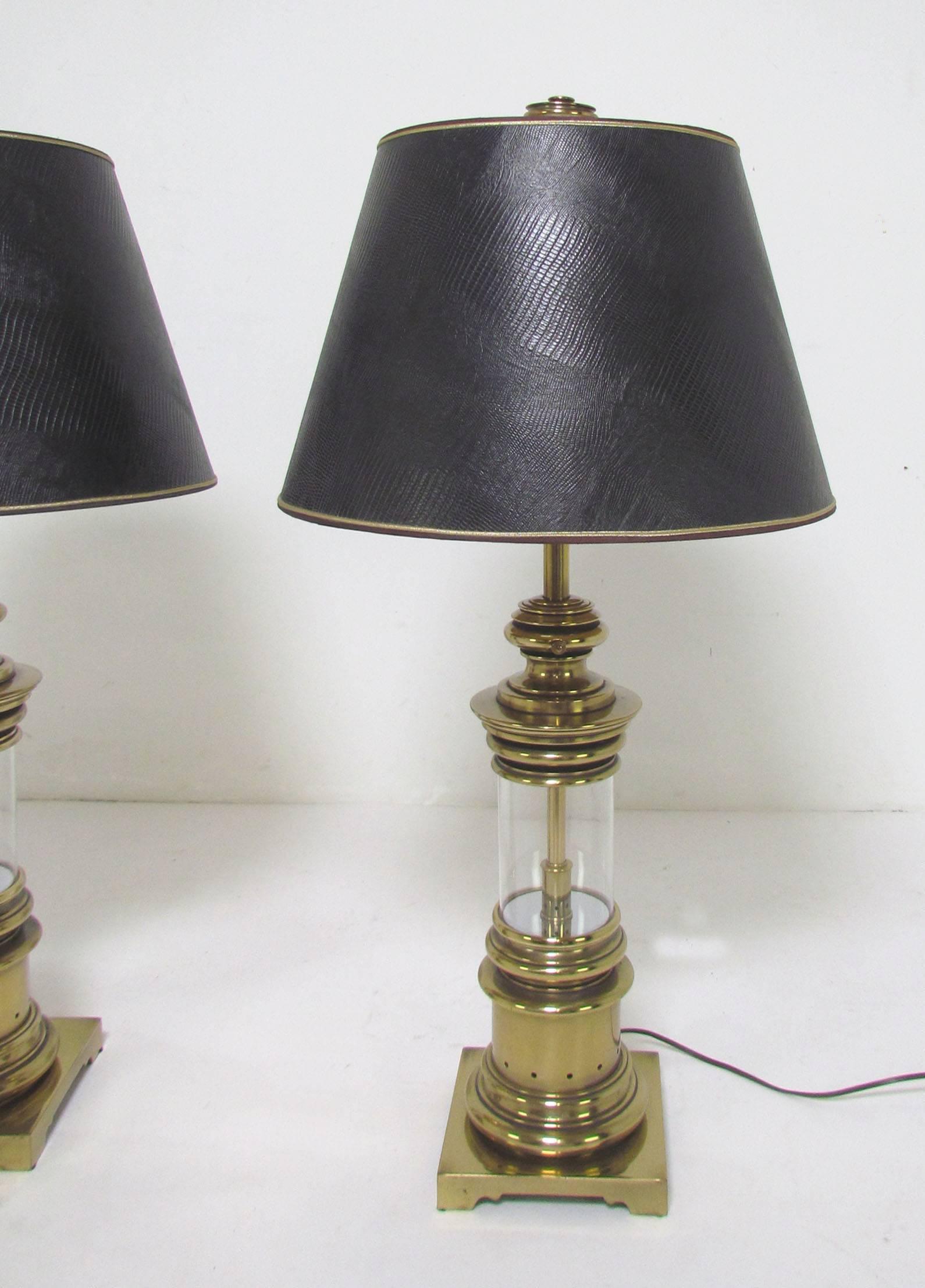 Impressive pair of brass table lamps by Stiffel, with original finials and shades, circa 1960s.

36" high to top of finials, bases are 7.5" square.
Shades measure 11.5" high, 18" in diameter.