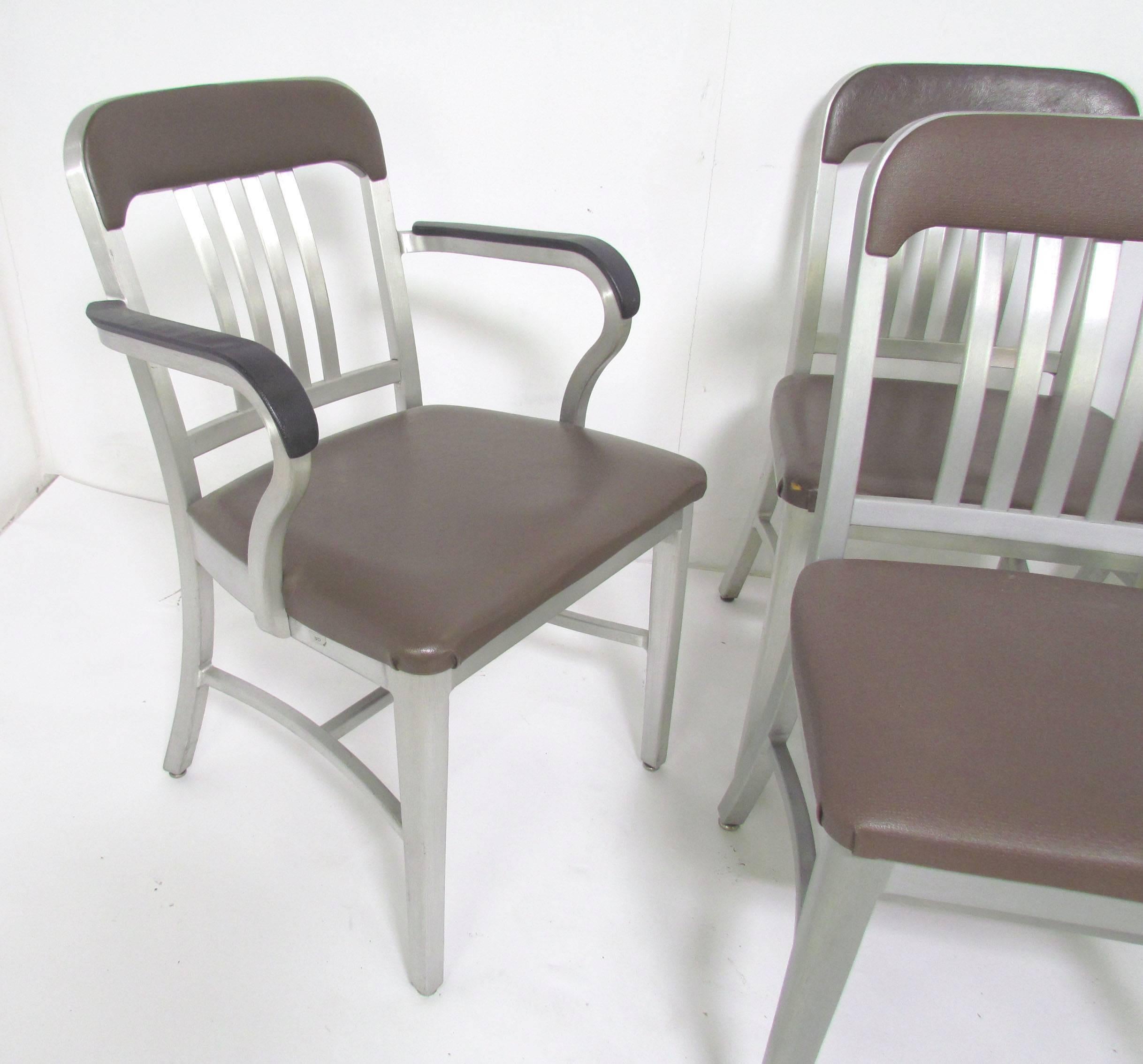 Set of six Industrial aluminum GoodForm dining chairs, by General Fireproofing. Although some have slight differences in the upholstery (and label variations), these were used as a set of dining chairs and all came from the same home.

Set