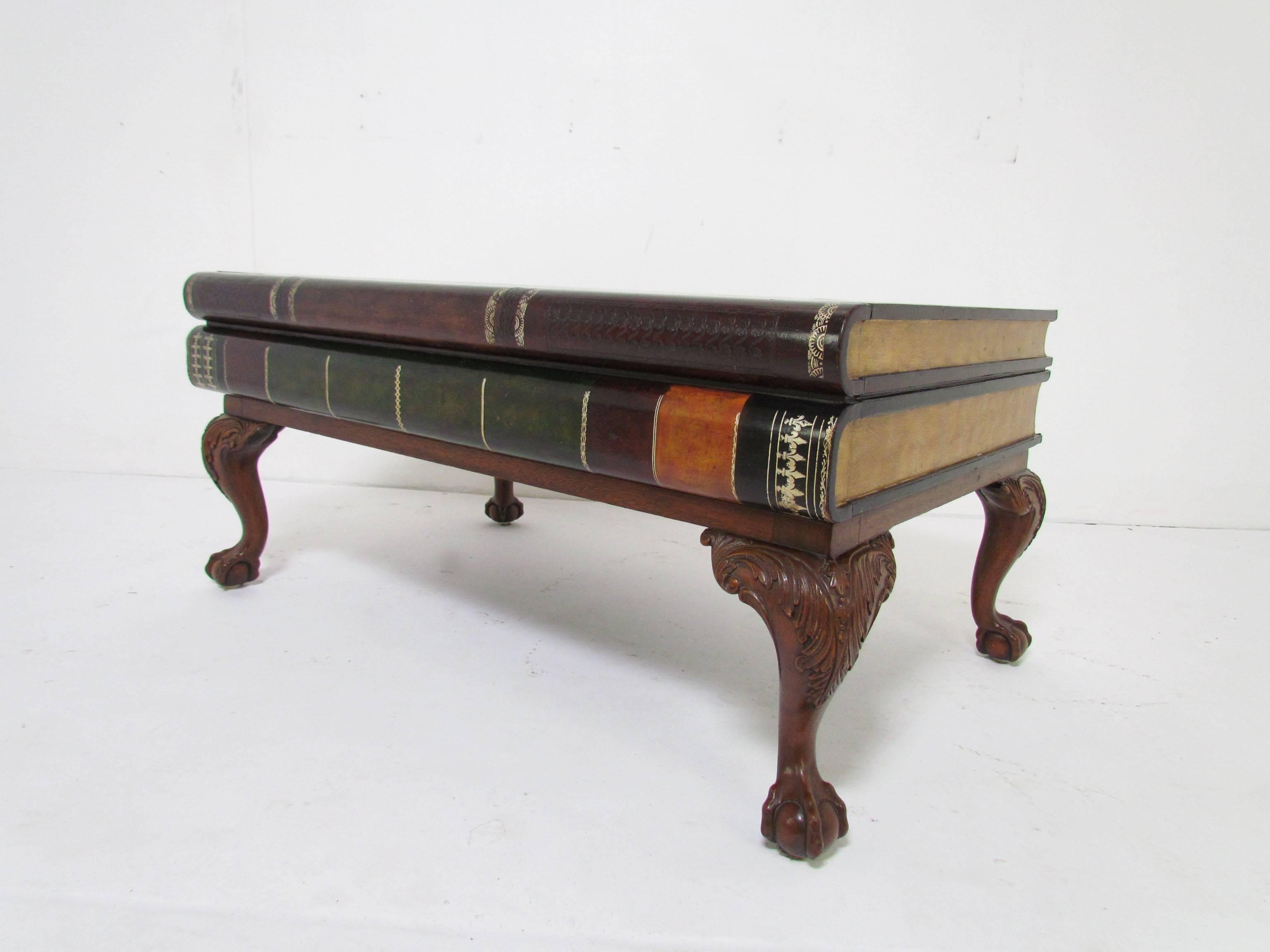 Bibliophile's coffee table by Maitland-Smith in the form of leather bound antiquarian stacked books, with a storage drawer. A rare version of this classic, on Georgian style wooden claw and ball legs.