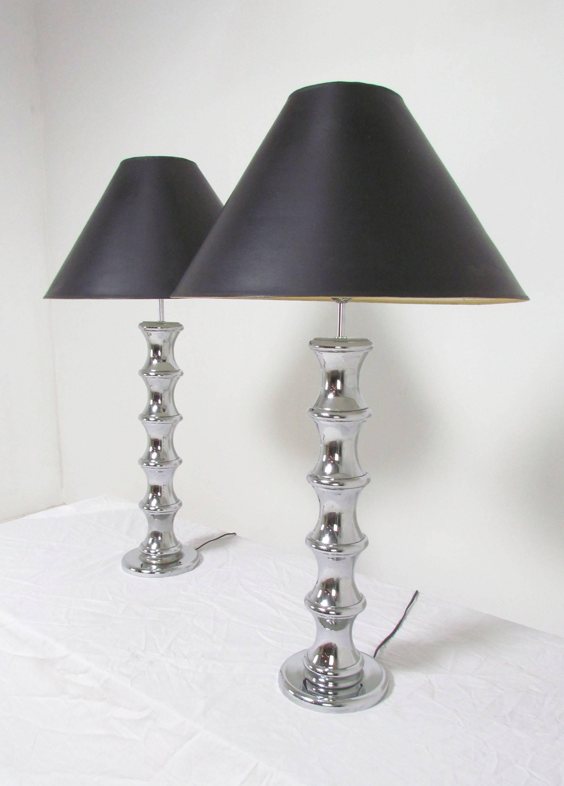Pair of rare chrome table lamps in a faux bamboo form by Robert Sonneman, circa 1970s.

Shades are in somewhat worn condition and will be included if desired.

Lamps measure 27.5