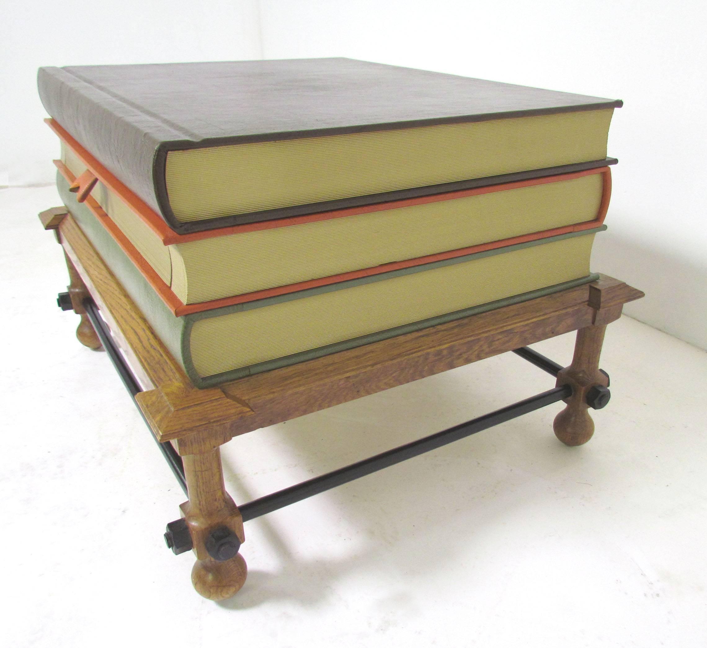 An occasional or side table by John Dickinson, in the form of a stack of bound volumes of Shakespeare's complete works (Histories, Tragedies and Comedies). The middle volume conceals a drawer opened by pulling on a 