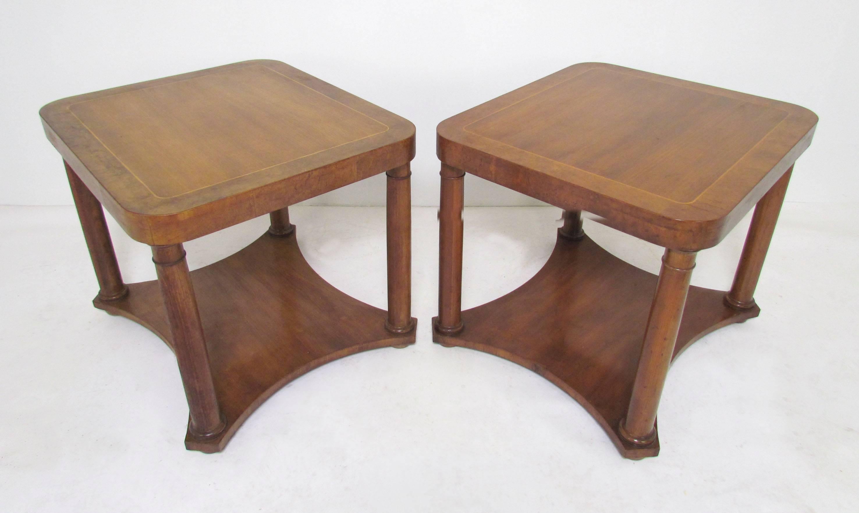 Pair of Minimalist columnar end tables in the Regency style by Baker Furniture in burl and walnut, circa 1960s.

Can be oriented as 27" wide (24" deep), or as 24" wide (27" deep.)