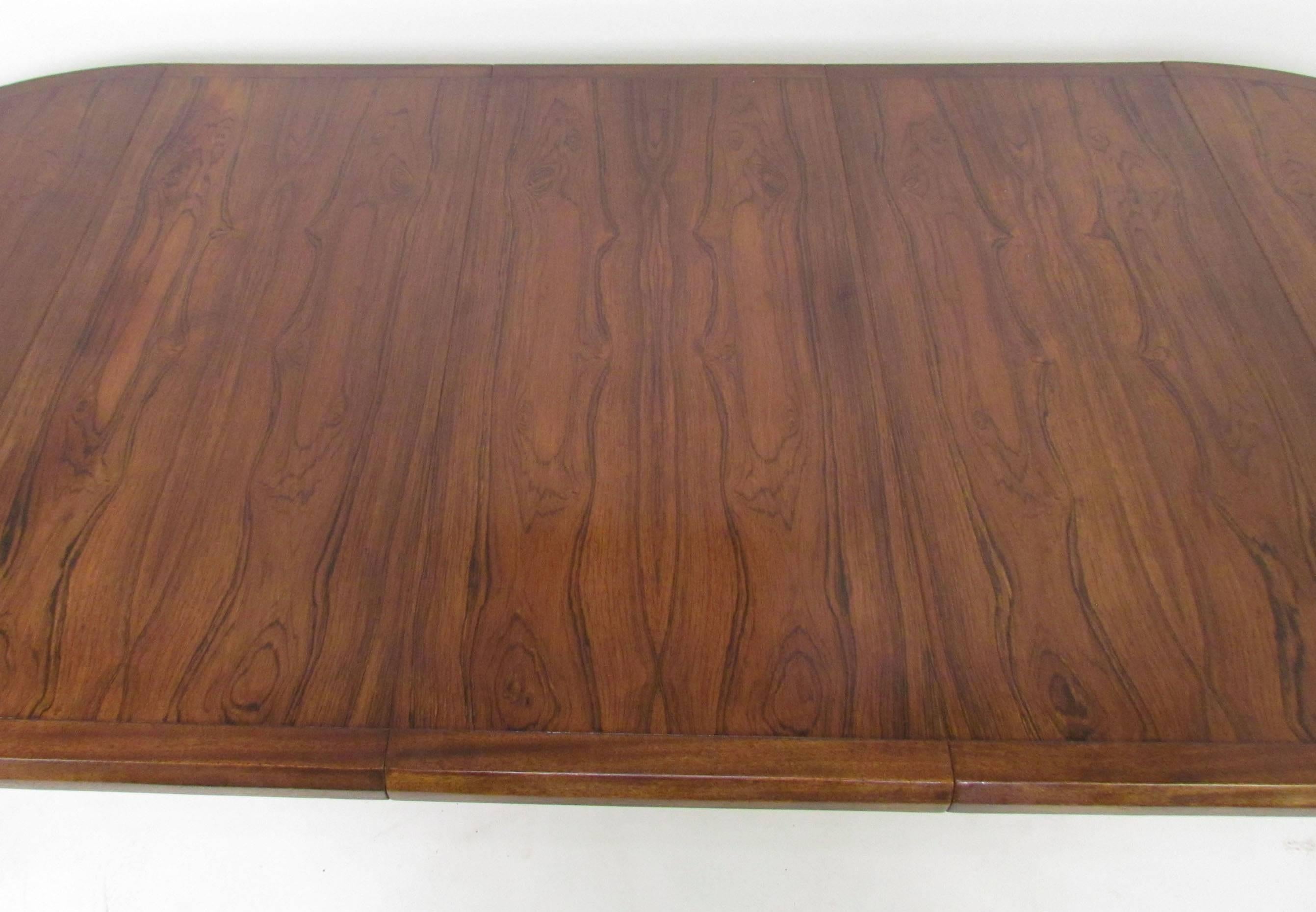 Mid-20th Century Mid-Century Circular Rosewood Dining Table with Three Leaves by John Stuart