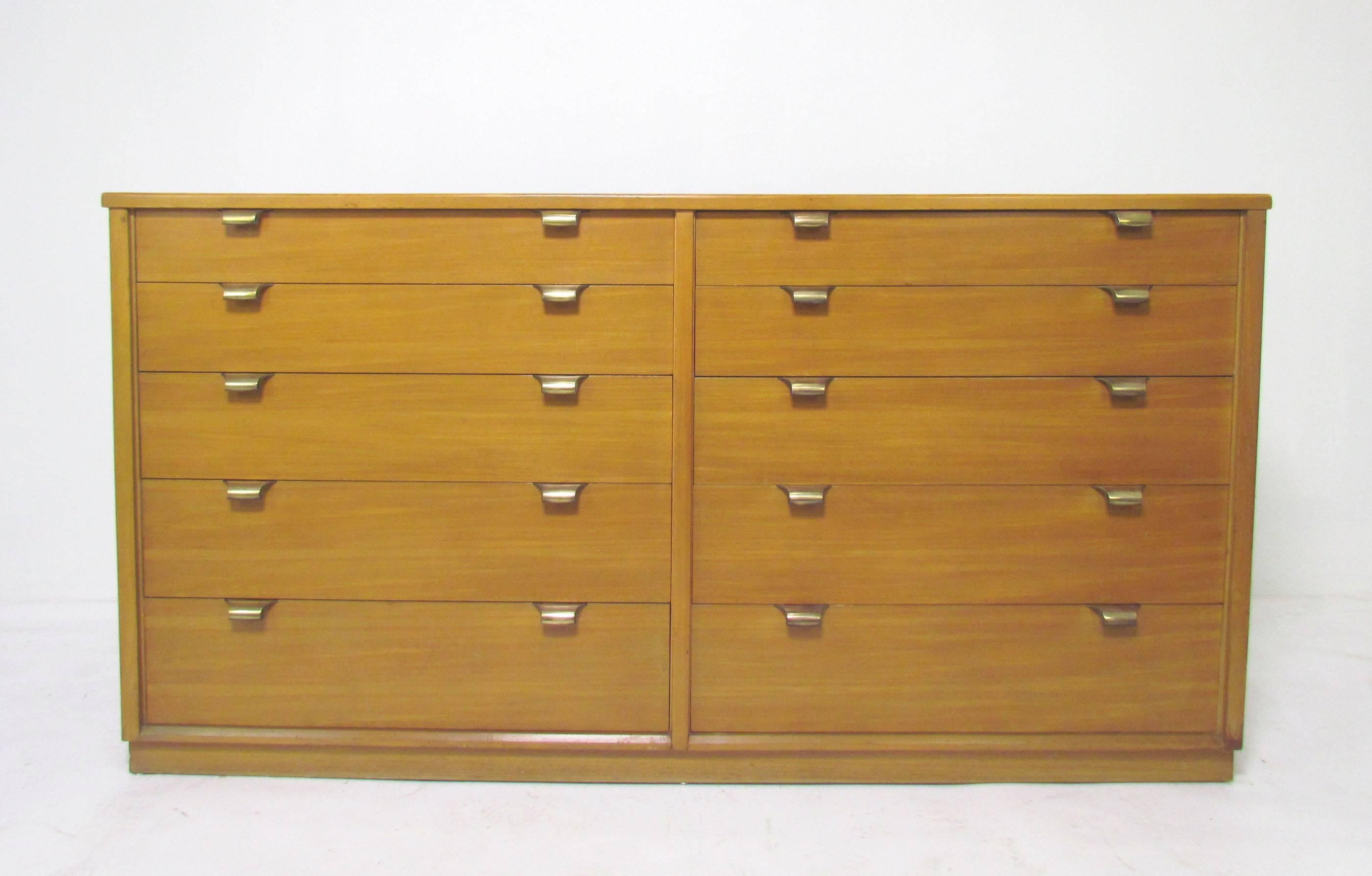 Ten-drawer dresser in glazed elm with brass hardware, designed by Edward Wormley for Drexel’s Precedent Line, dated 1949.