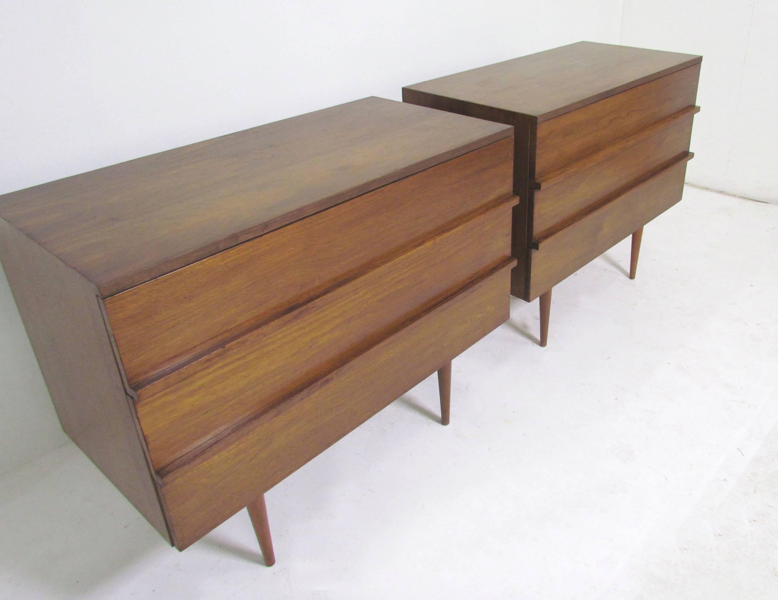 Pair of three-drawer chests in walnut, circa 1960s.