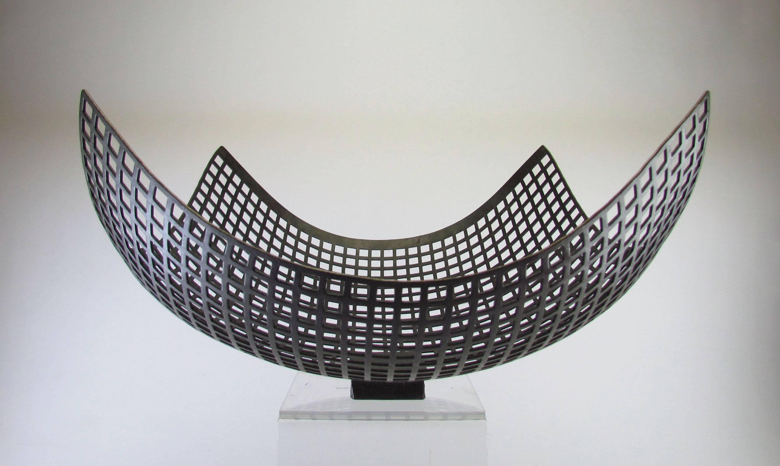 Sculptural centerpiece bowl in wrought iron by metalsmith Lars Larsson, Sweden, ca. 1970s.

Larsson, a sculptor whose work is represented in numerous art museums in Sweden also created very limited quantities of hand-wrought utilitarian wares.  He