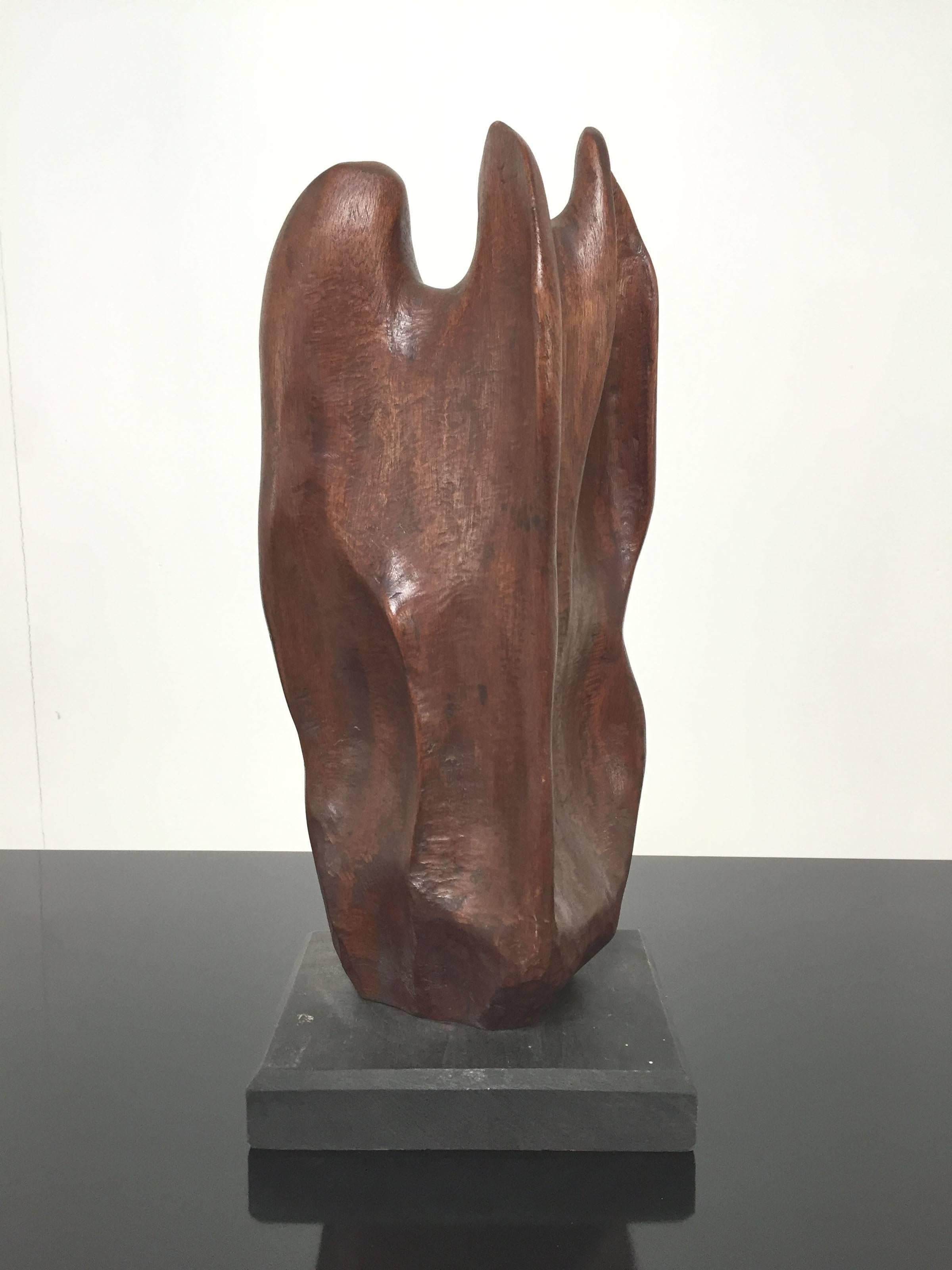 Organically abstract hand-carved wood sculpture titled 