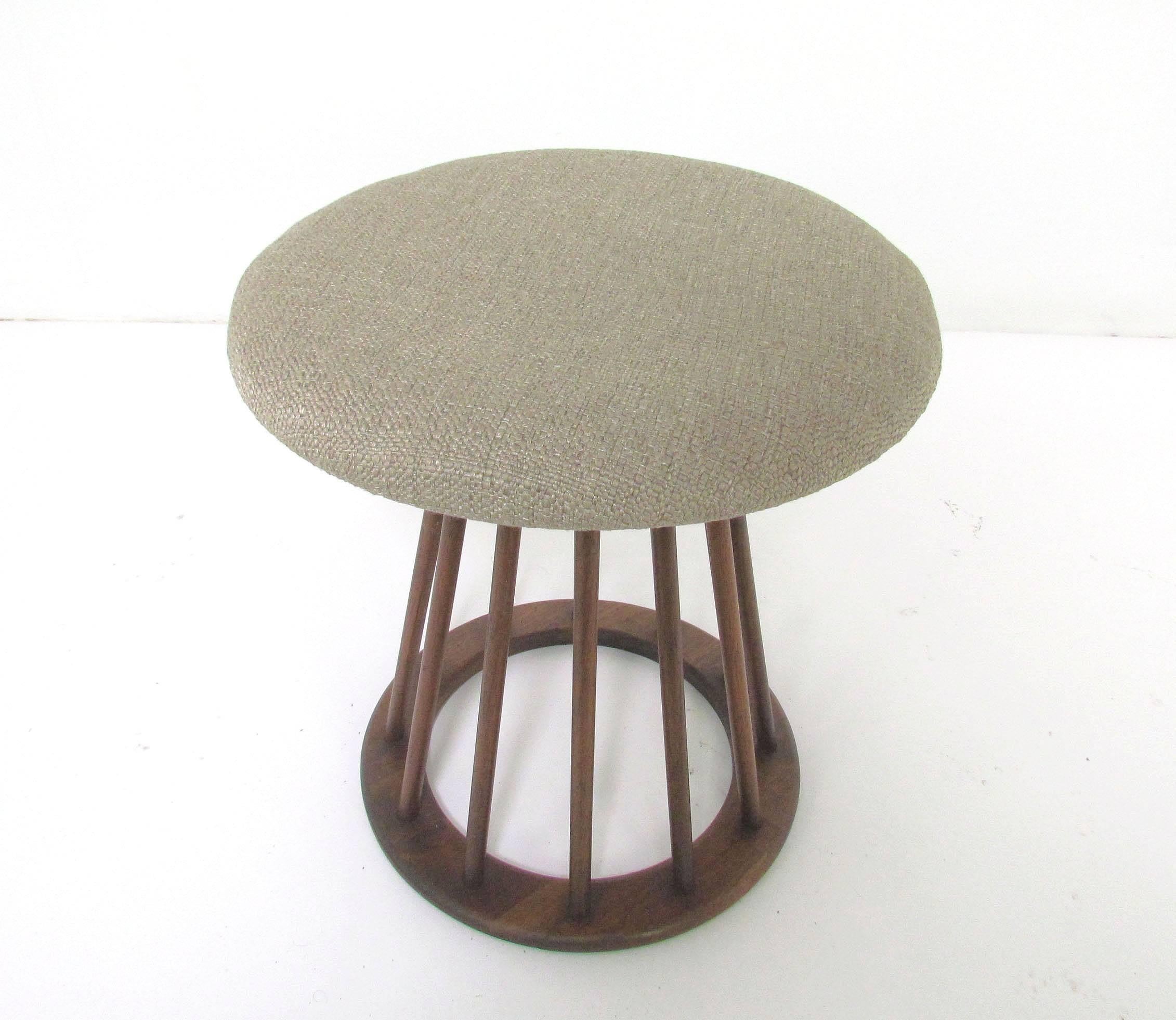 A versatile foot stool by Arthur Umanoff for Washington woodcraft, spindled base in walnut, with upholstered seat, circa 1960s.
