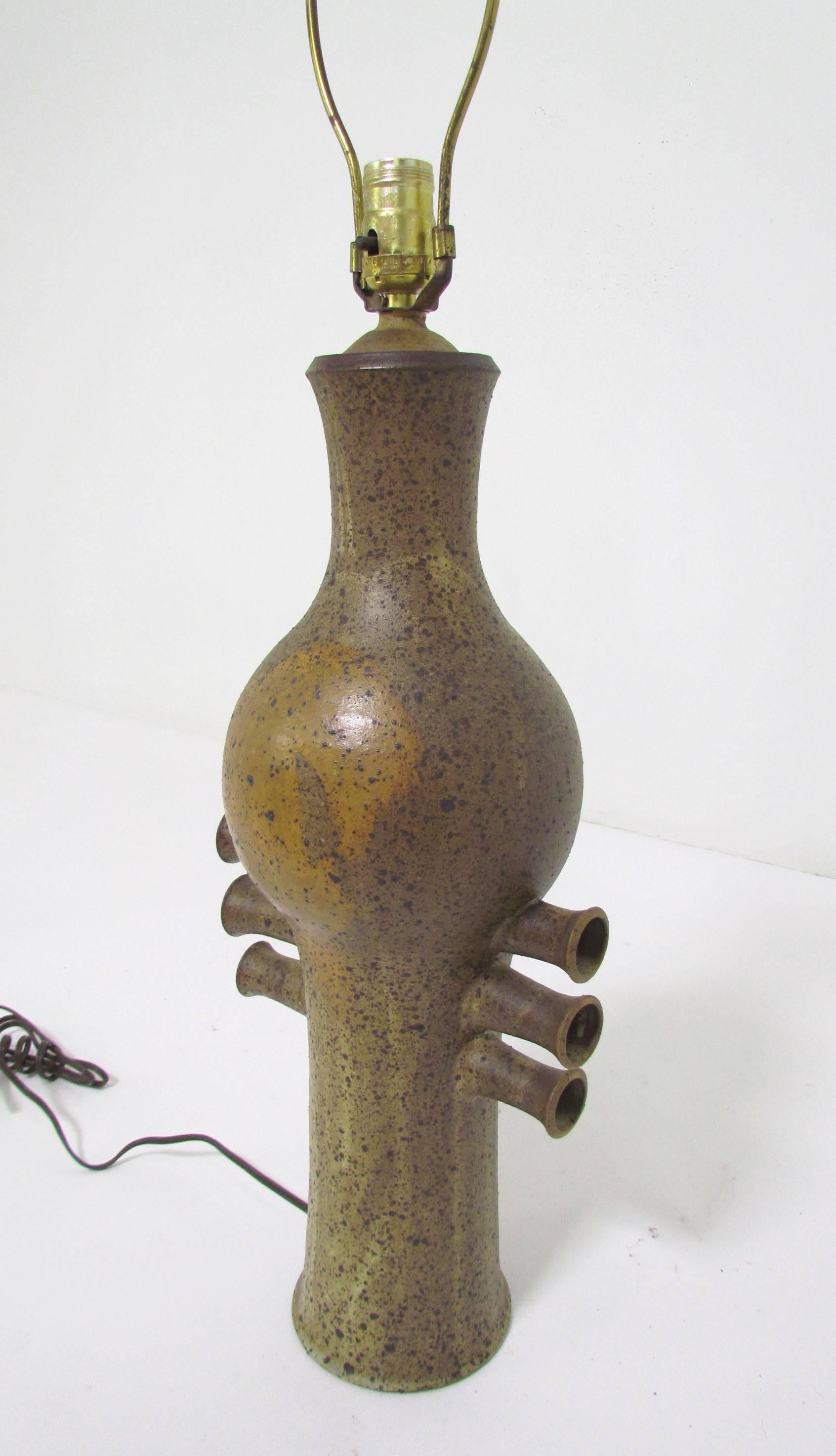Sculptural hand thrown stoneware pottery lamp, circa 1970s. Impressive organic form. Height to top of finial is 34.5