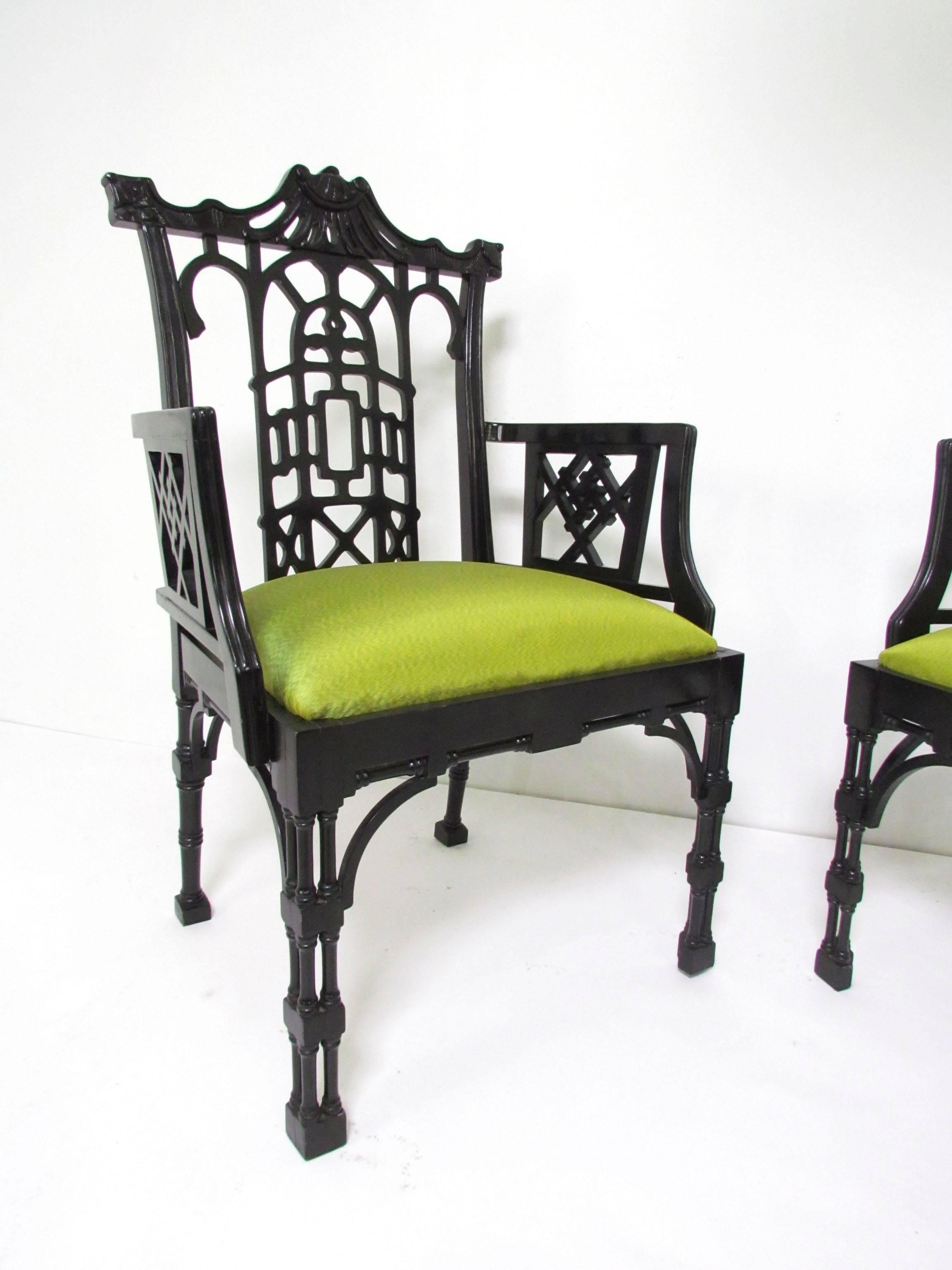 Pair of carved and lacquered fretwork armchairs in the Chinese Chippendale style, circa 1980s. Silk upholstered cushions.