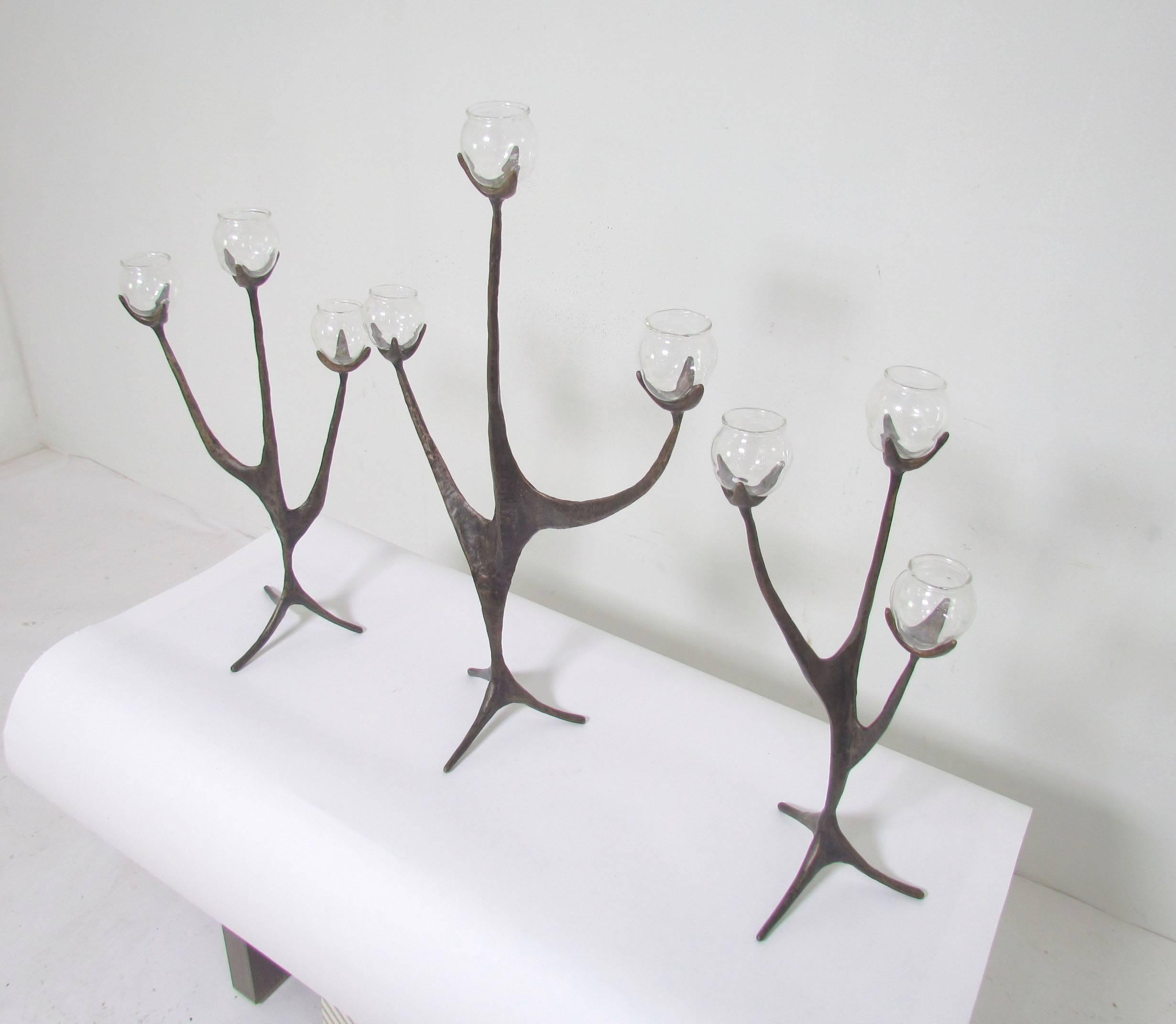 Magnificent and unusual bronze sculptural oil lamp Hanukkah menorah (or candelabra) in three parts by Israeli artist Aharon Bezalel. handblown glass oil cups are molded to fit in the candelabra arms. Includes two extra glass cups.  Cups can be