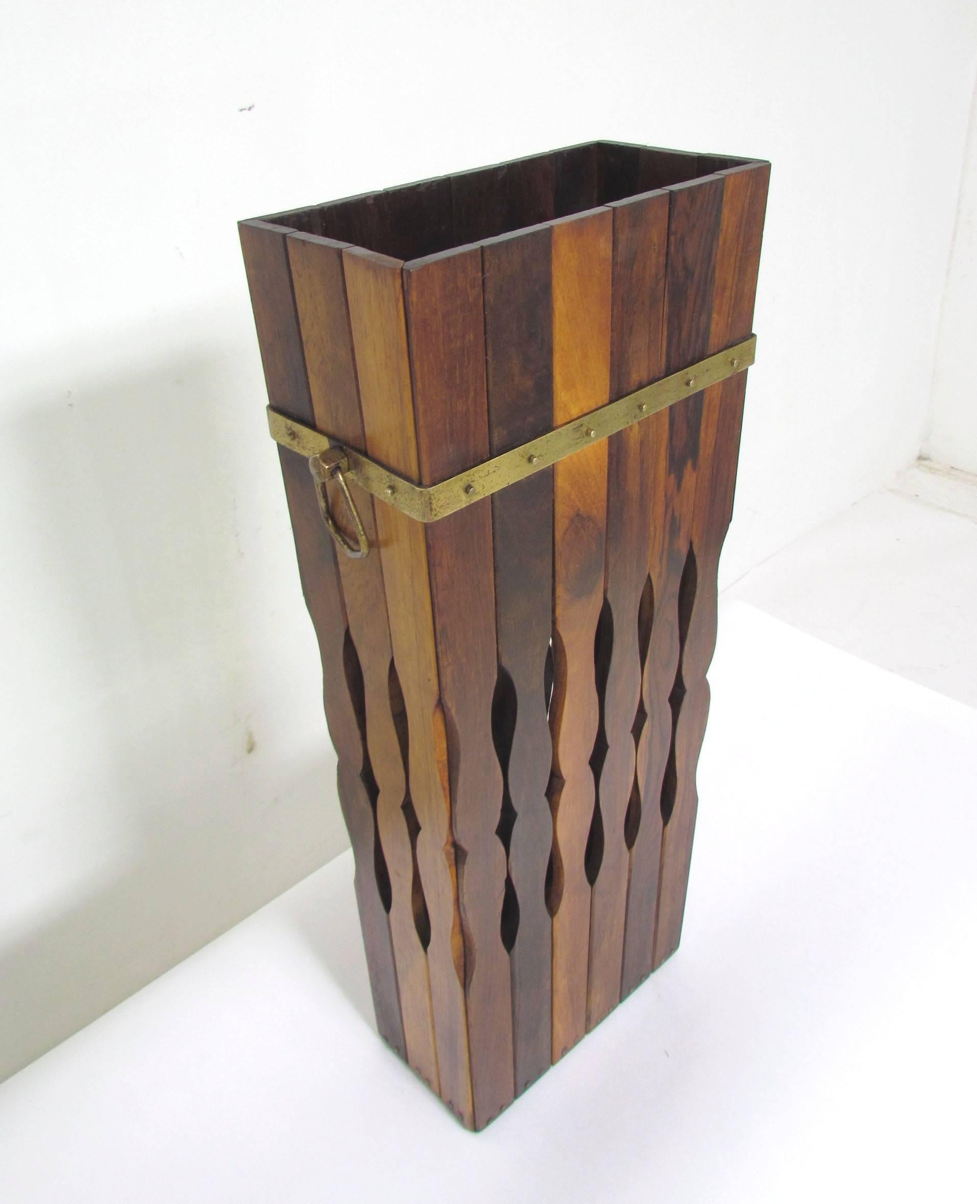 Elegant rosewood umbrella stand with cut-out accents, brass banding and nailhead stud accents, circa early 1970s, made in Brazil by Arte e Decoracoes, Fantozzi Ltd.