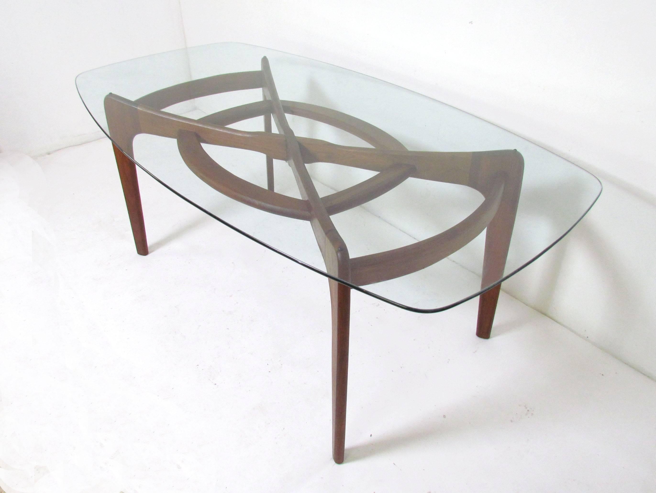 Mid-Century Modern sculptural elongated "compass" dining table in solid walnut by Adrian Pearsall for Craft Associates, circa 1960s.