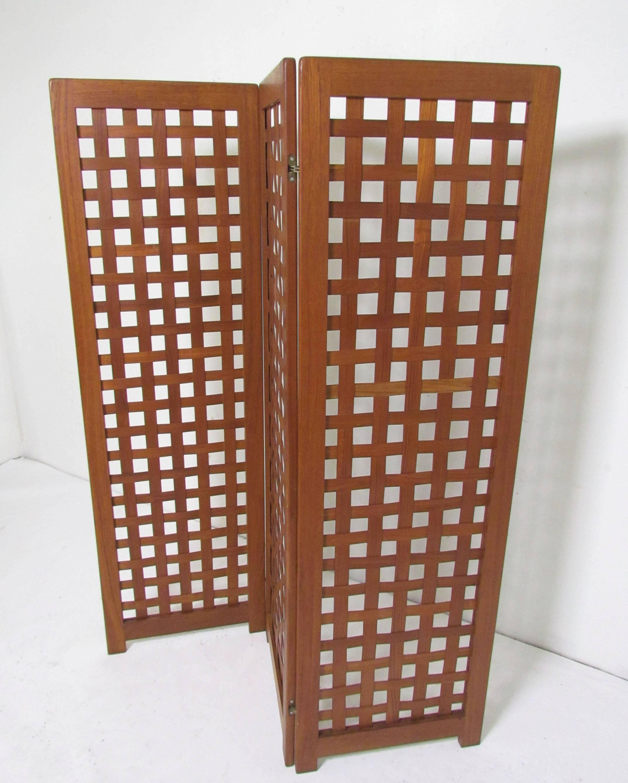Teak three-panel basket weave screen circa 1970s, marked made in Denmark.

Overall height is 59