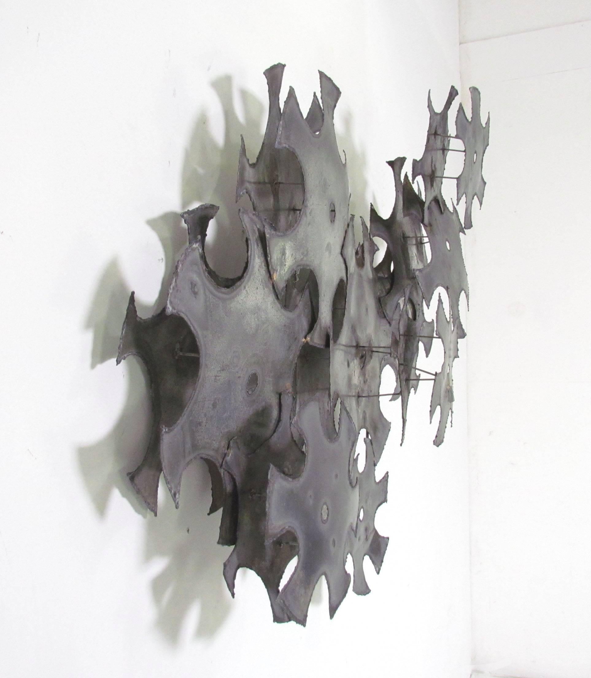 Industrial metal work abstract wall sculpture by Don Freedman, circa 1970s. Noted for his textile fibre art, Freedman also created metal wall sculpture.