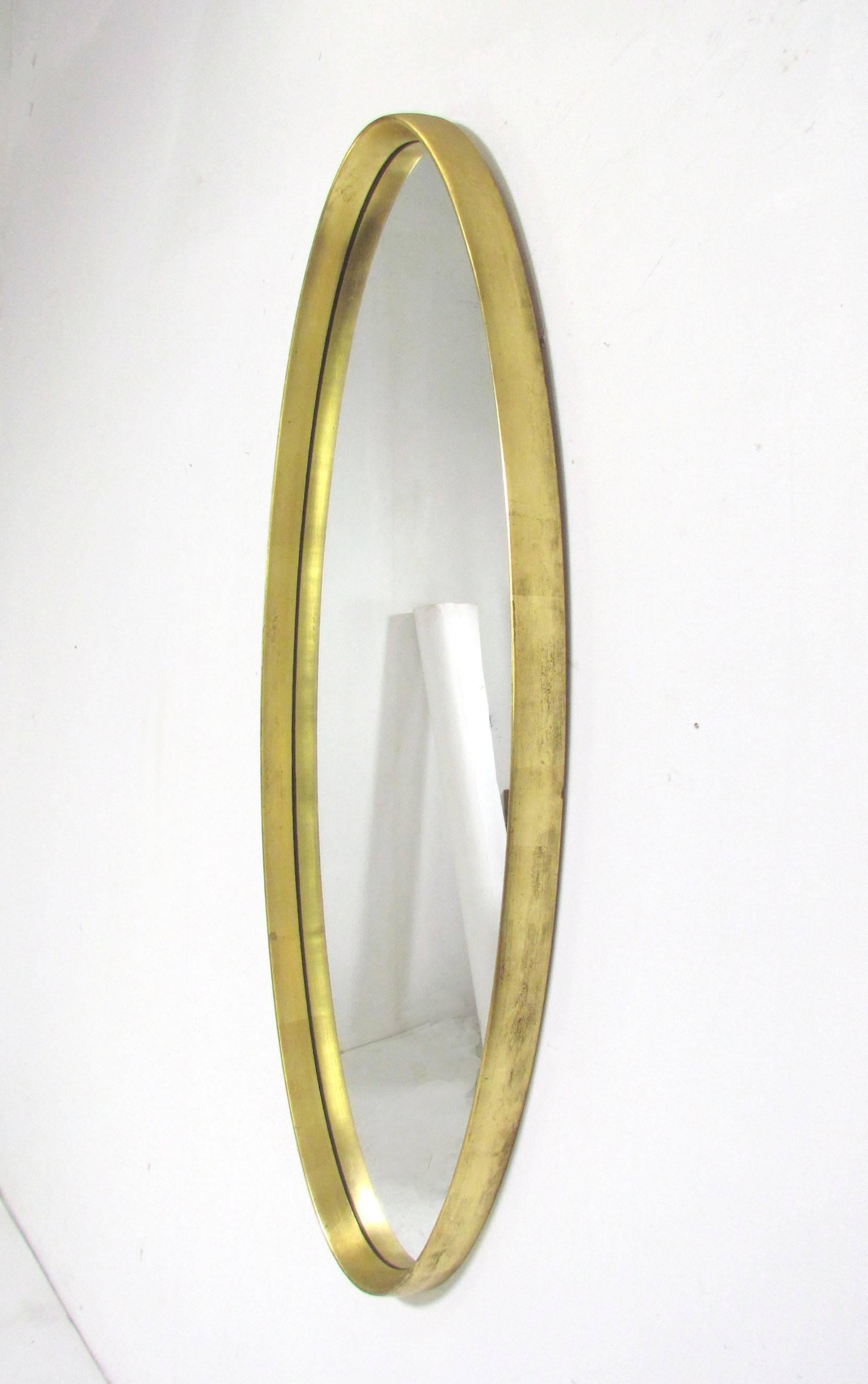 Classic Mid-Century gold leaf oval wall mirror, signed La Barge.