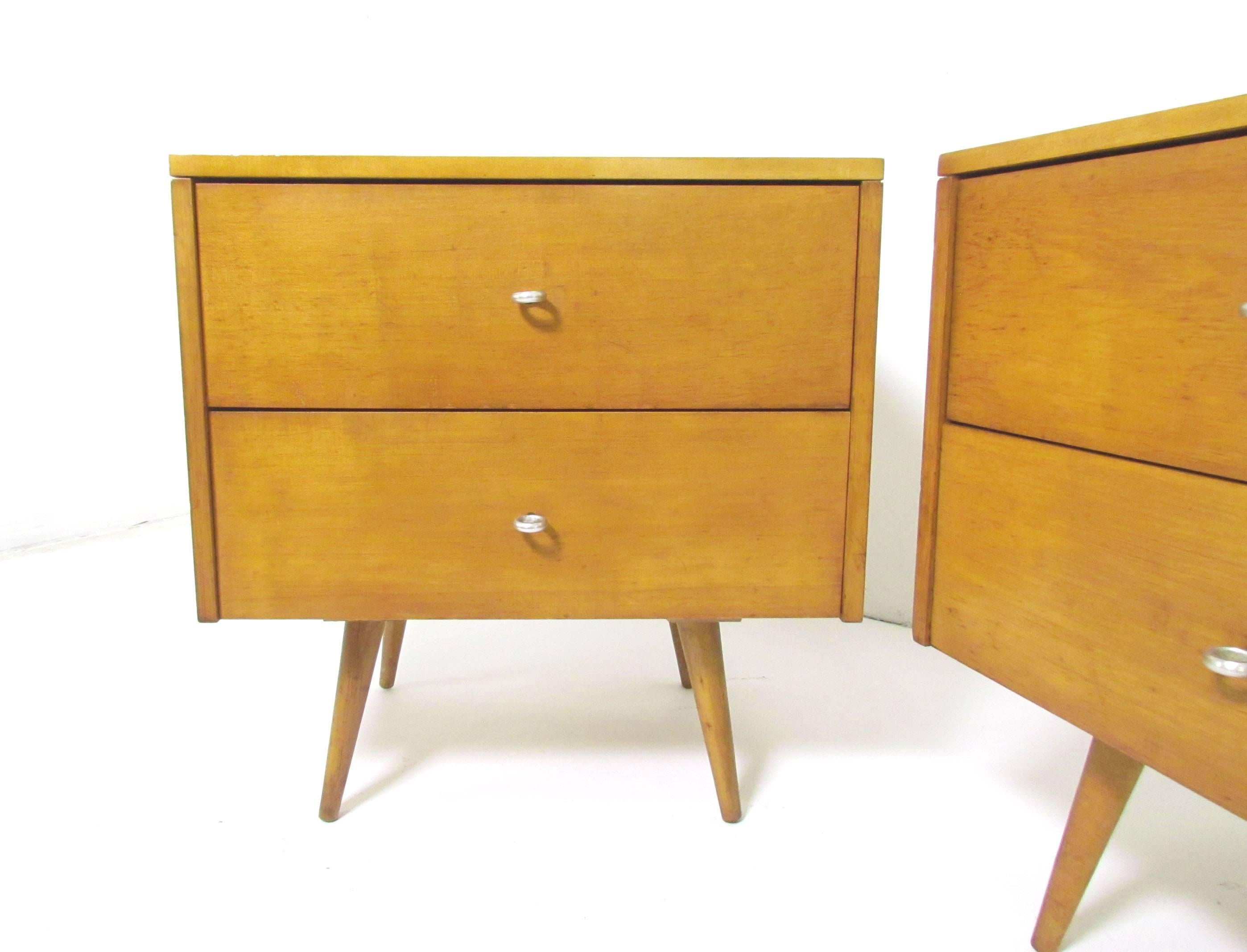 Pair of nightstands or two-drawer cabinets with ring pulls, designed by Paul McCobb for Planner Group, Winchendon Furniture Co., circa 1950s.