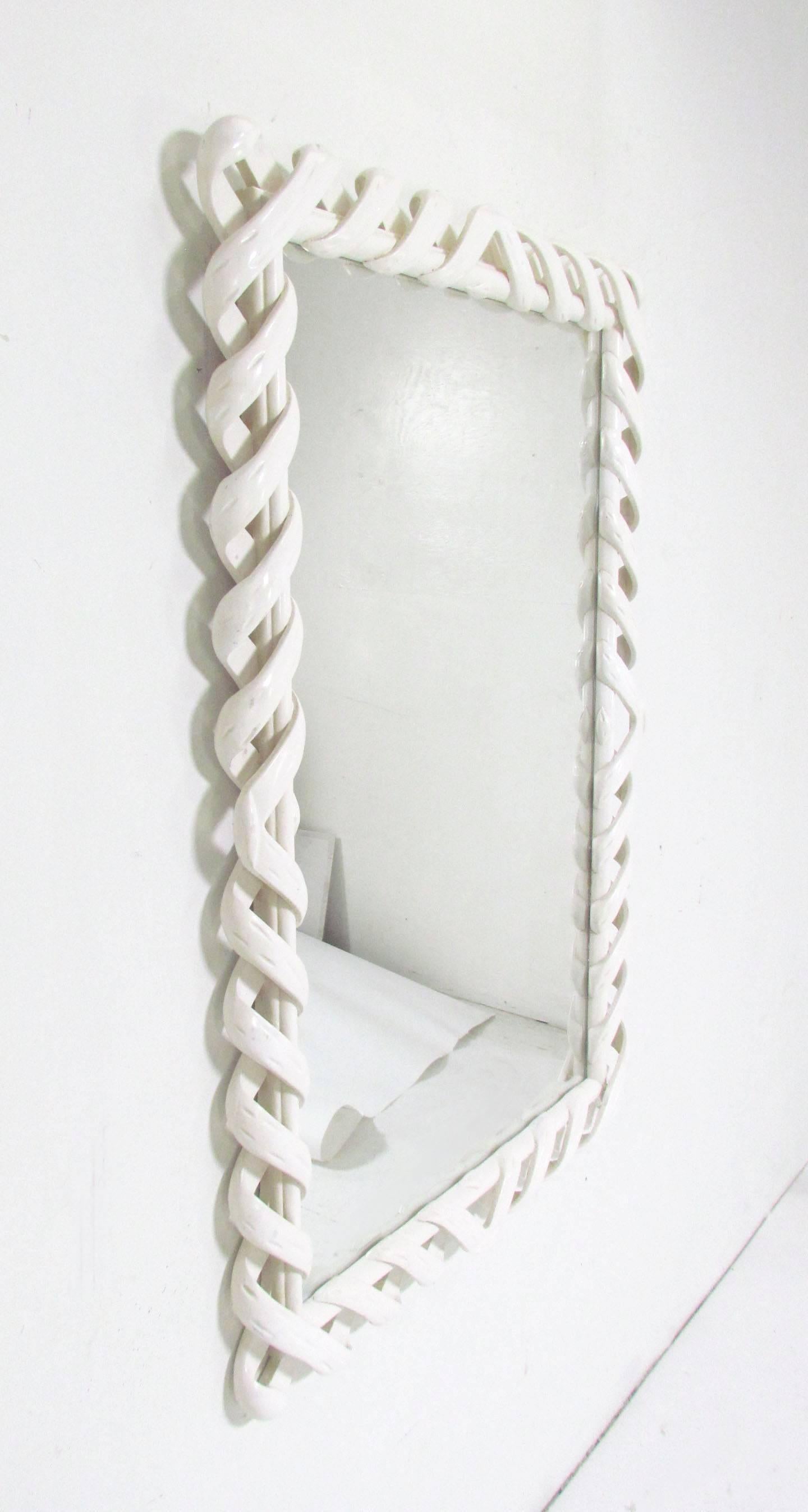Large ribbon work wall mirror in carved and lacquered wood by D. Milch & Son, circa 1960s. Can be oriented either vertically as shown or horizontally.
 