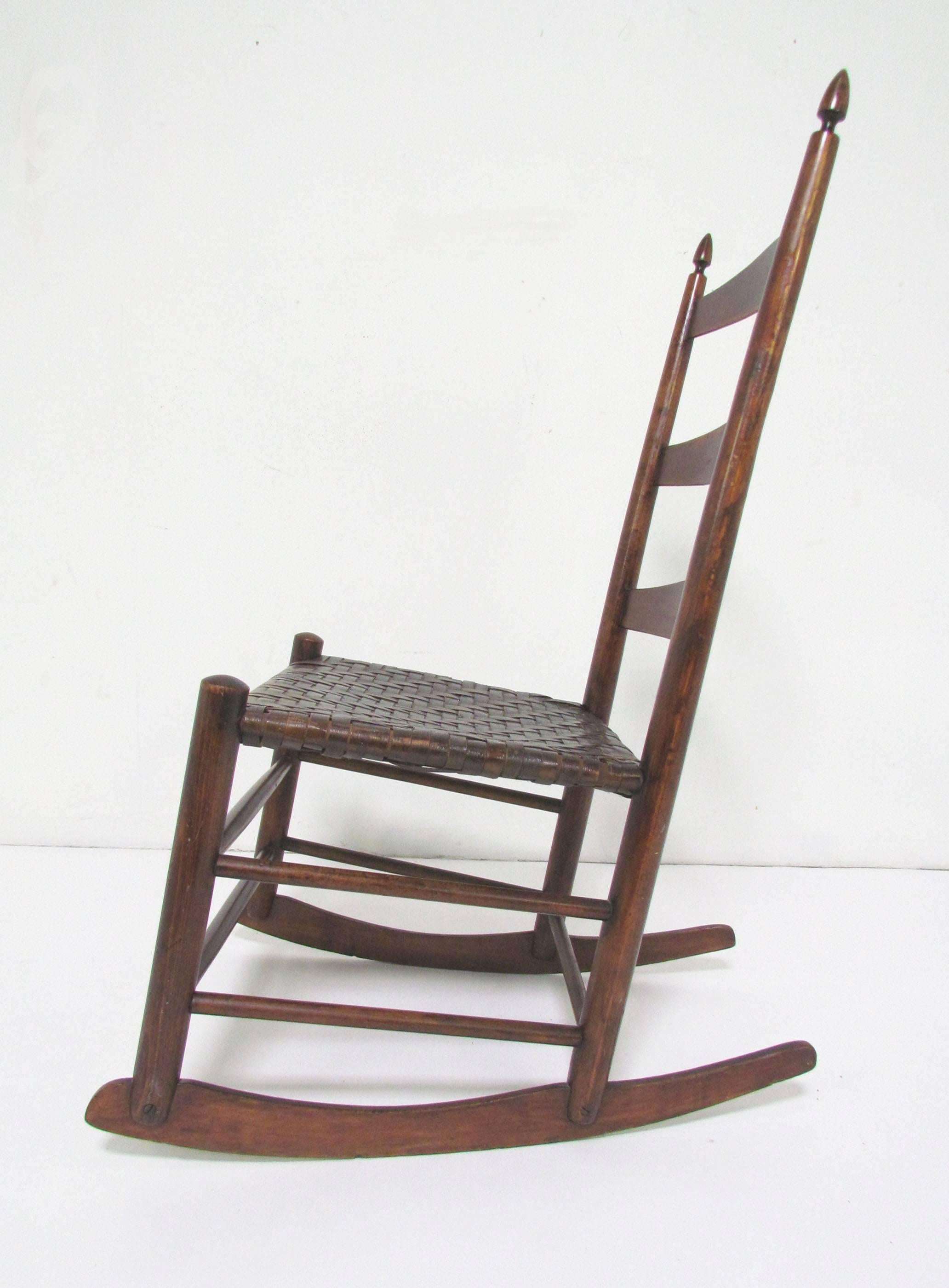 Antique Shaker rocker, circa 1890s. Impressed mark, Model No. 3, on back slat. In stained maple with original woven splint seat.