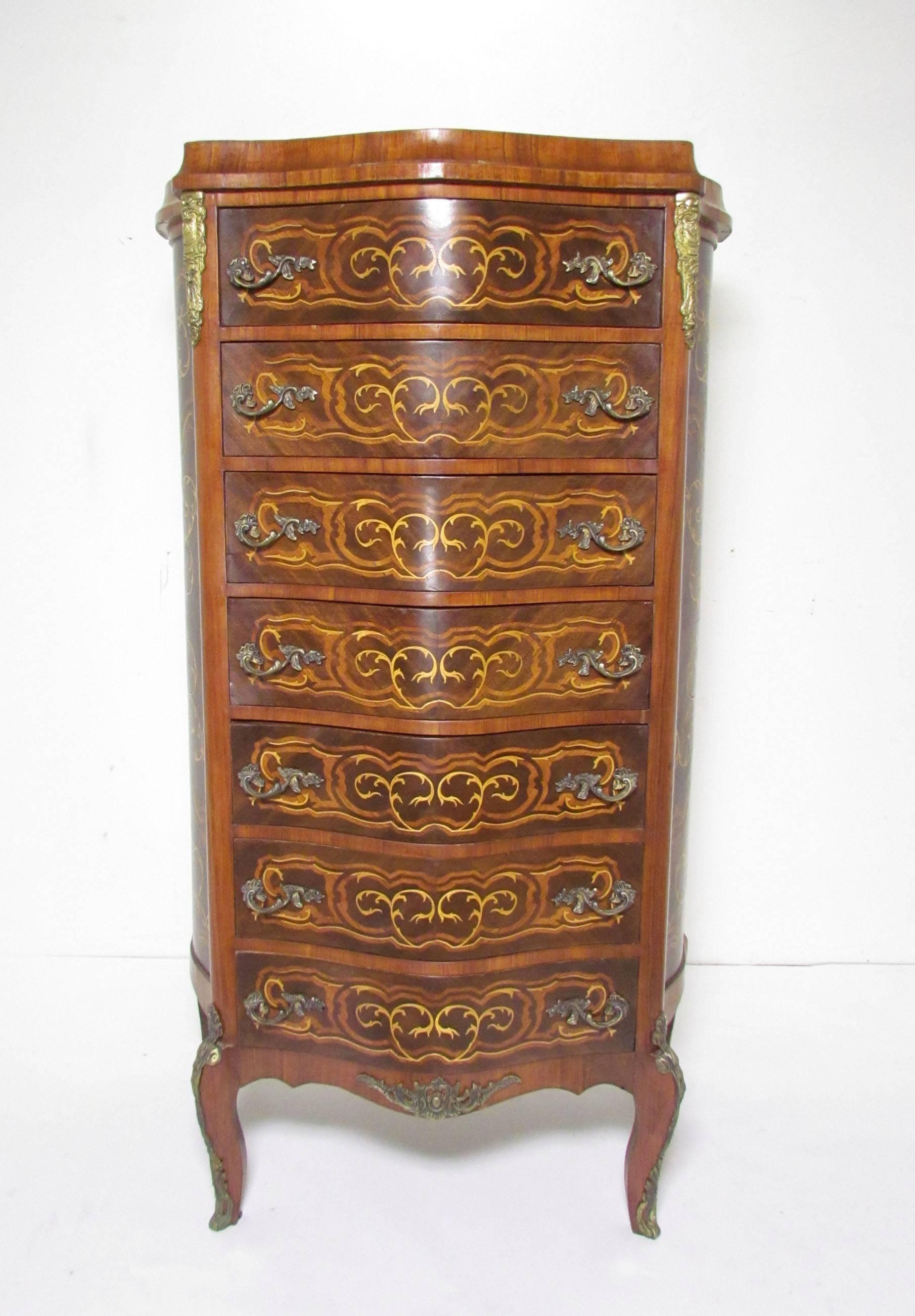 Louis XV style semainier dresser with brass-mounted ormolu and elaborate marquetry inlay, circa early 20th century.