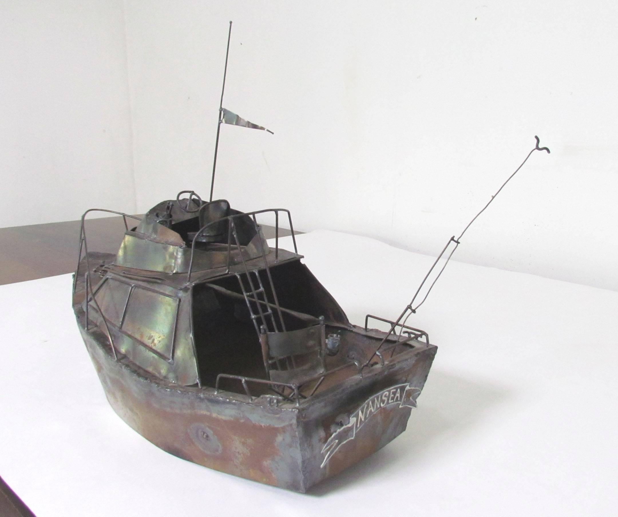 Charming metal fabricated sculpture of a charter fishing boat the 