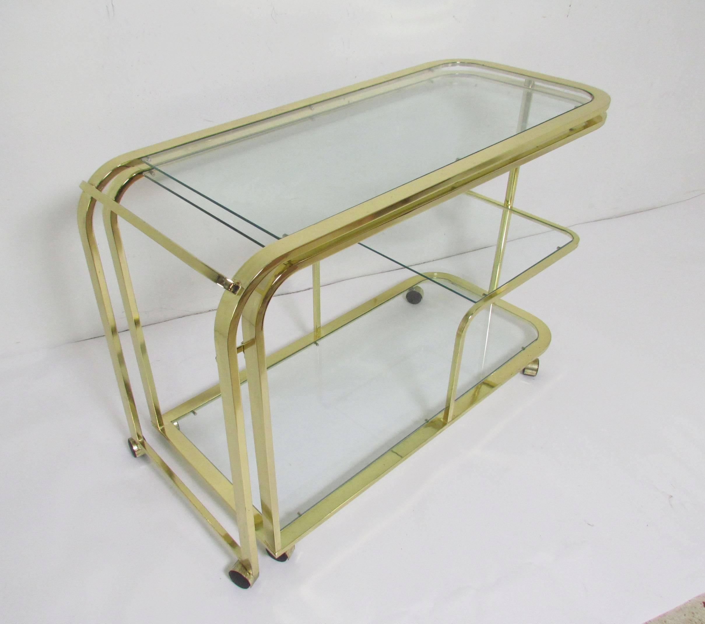 A three-tier bar cart by Design Institute America, High Point NC. Besides functioning as a handsome trolley, this piece can be opened as a full bar to serve guests.

Measures 86.75