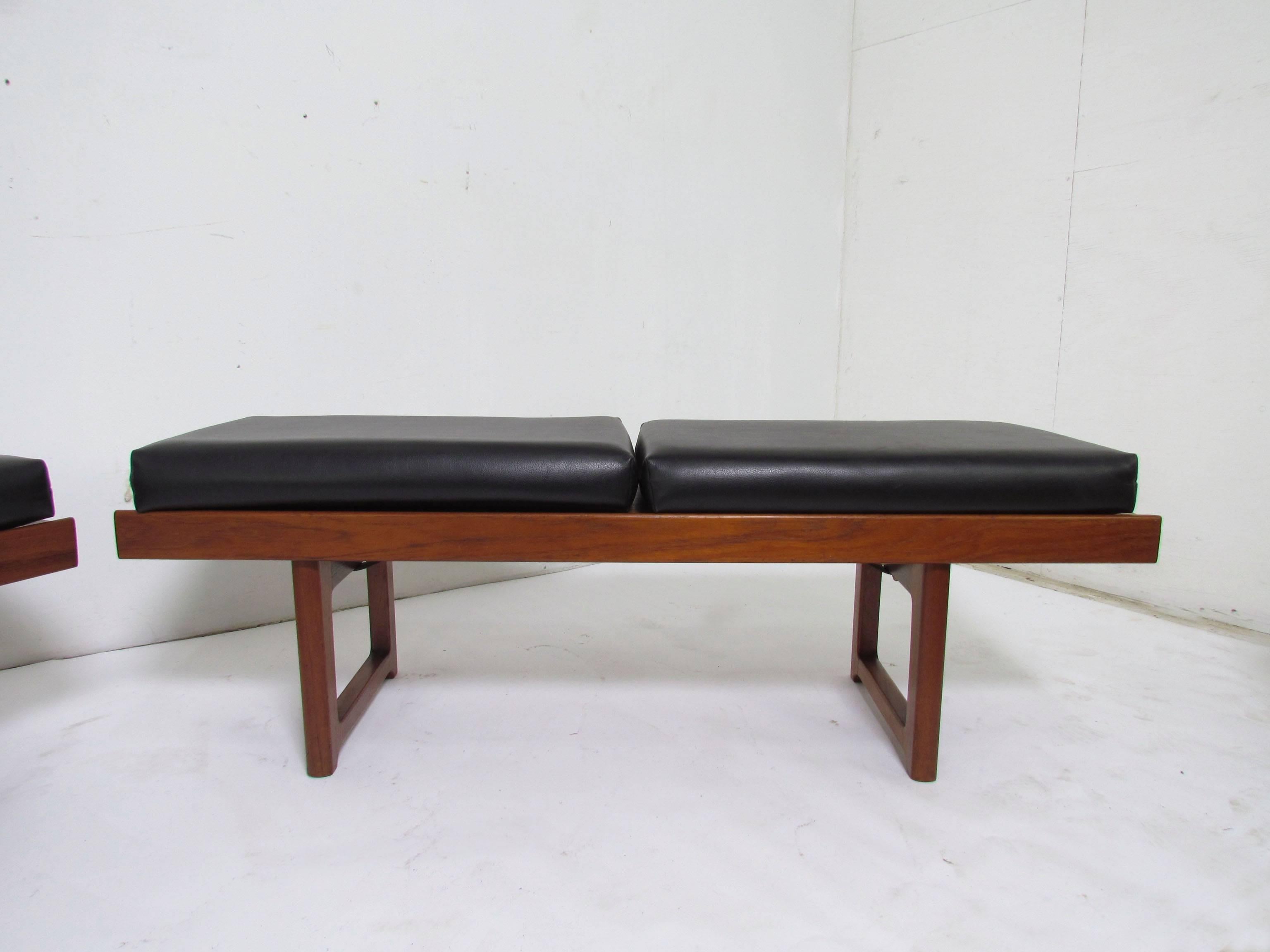 A pair of teak benches with original cushions, designed by Torbjørn Afdal for Bruksbo, made in Norway, circa 1960s. These can serve as either a coffee tables or seating.

Measures: Seat height (with cushions) is 16
