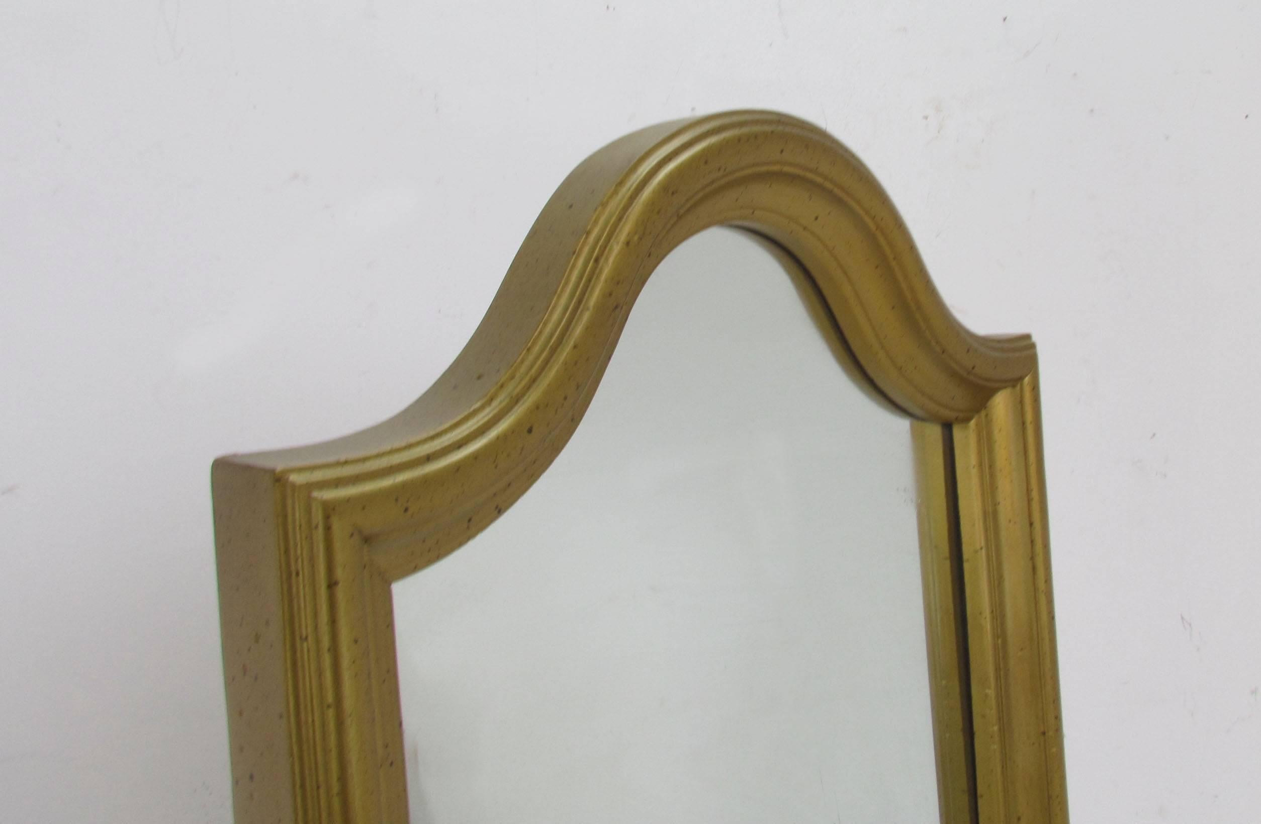 An adjustable angle cheval full length floor mirror in gilt finish, circa 1960s.