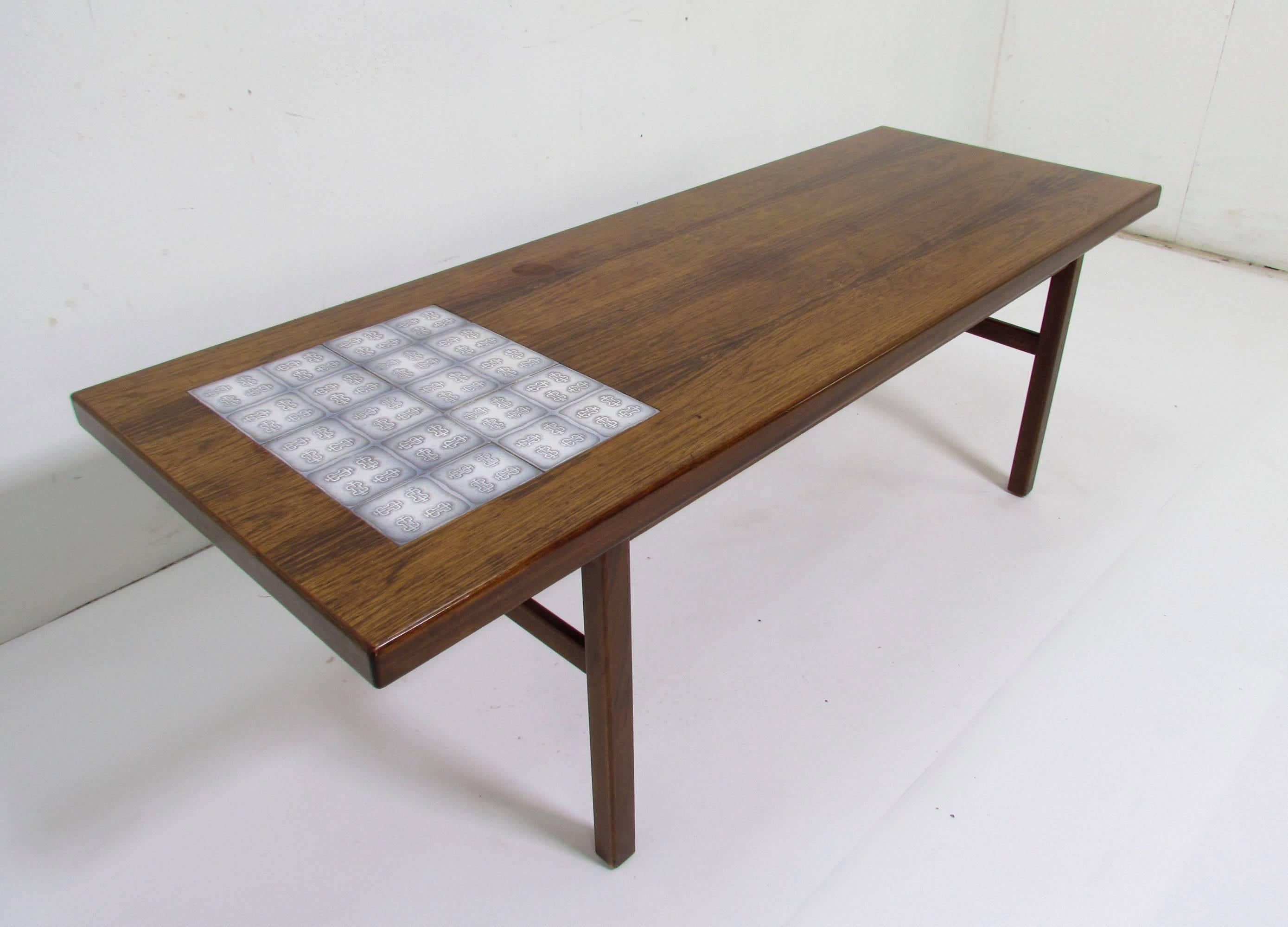 Midcentury Danish coffee table in rosewood with Royal Copenhagen tile panel accent, circa 1960s.