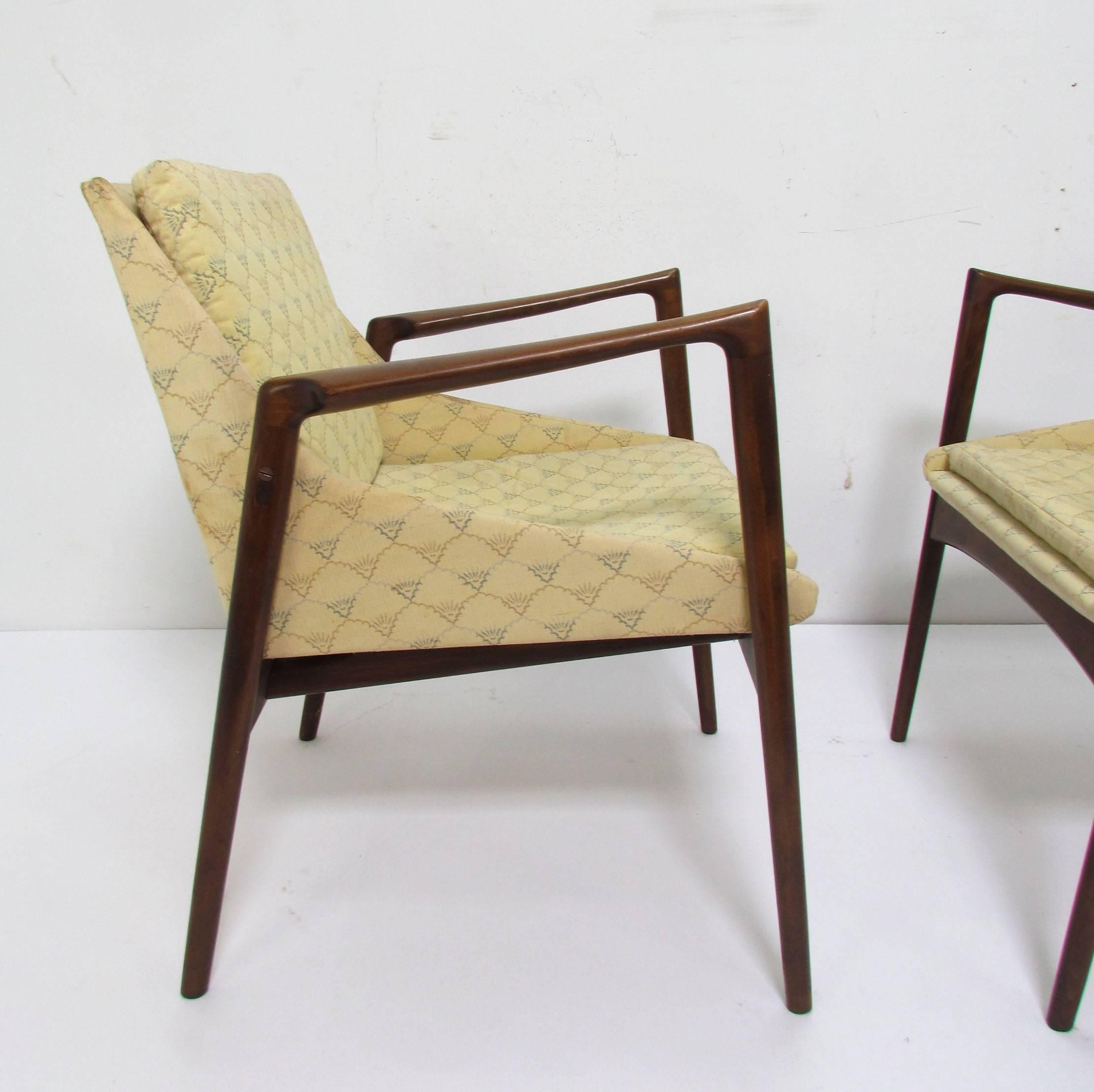 Pair of Danish lounge chairs with sculptural arms designed by Ib Kofod-Larsen for Selig, circa 1960s.