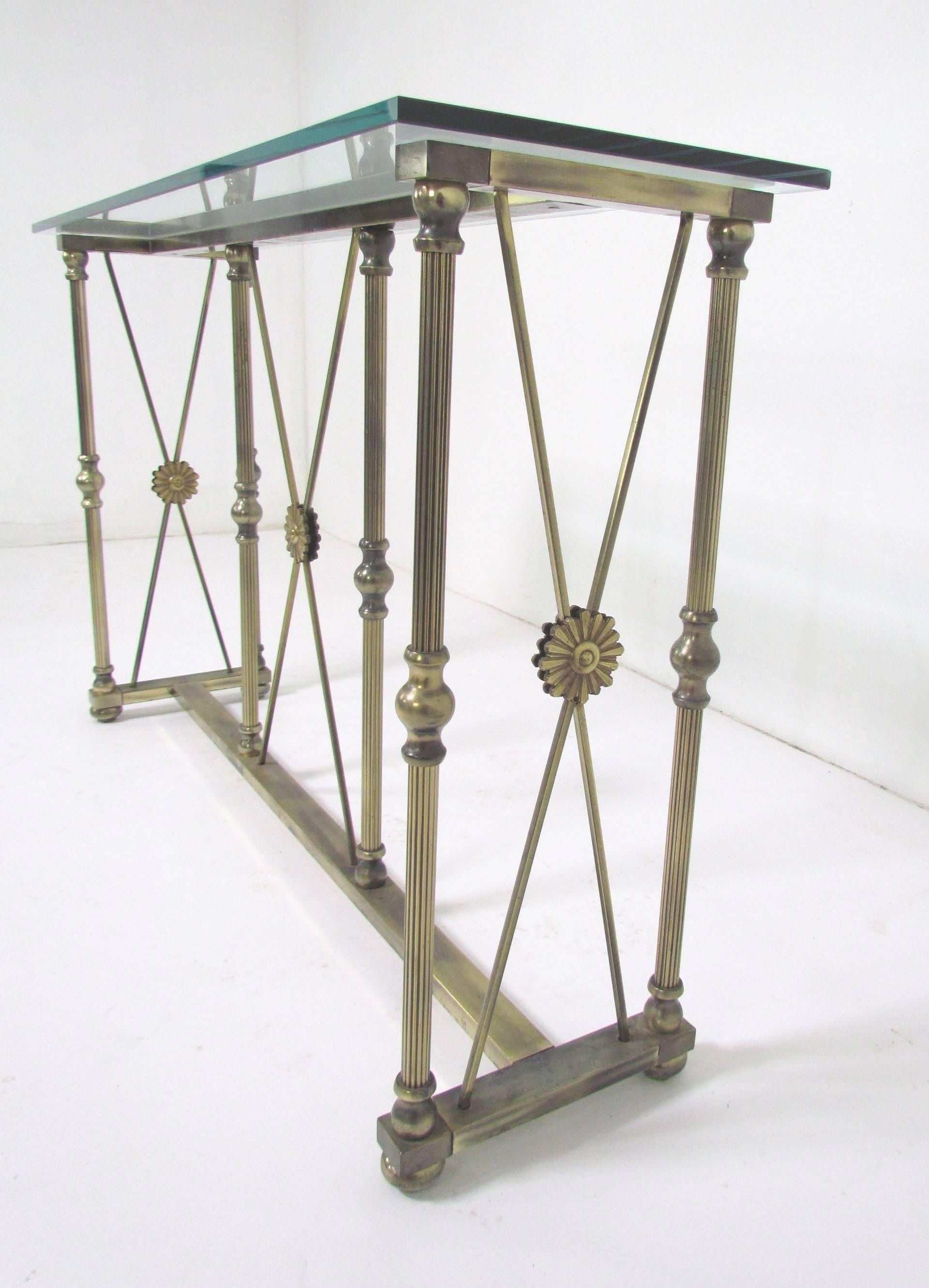 Console or sofa table by Mastercraft, made in Italy. Neoclassical-style medallions decorate all sides. Lovely patina to the brass.