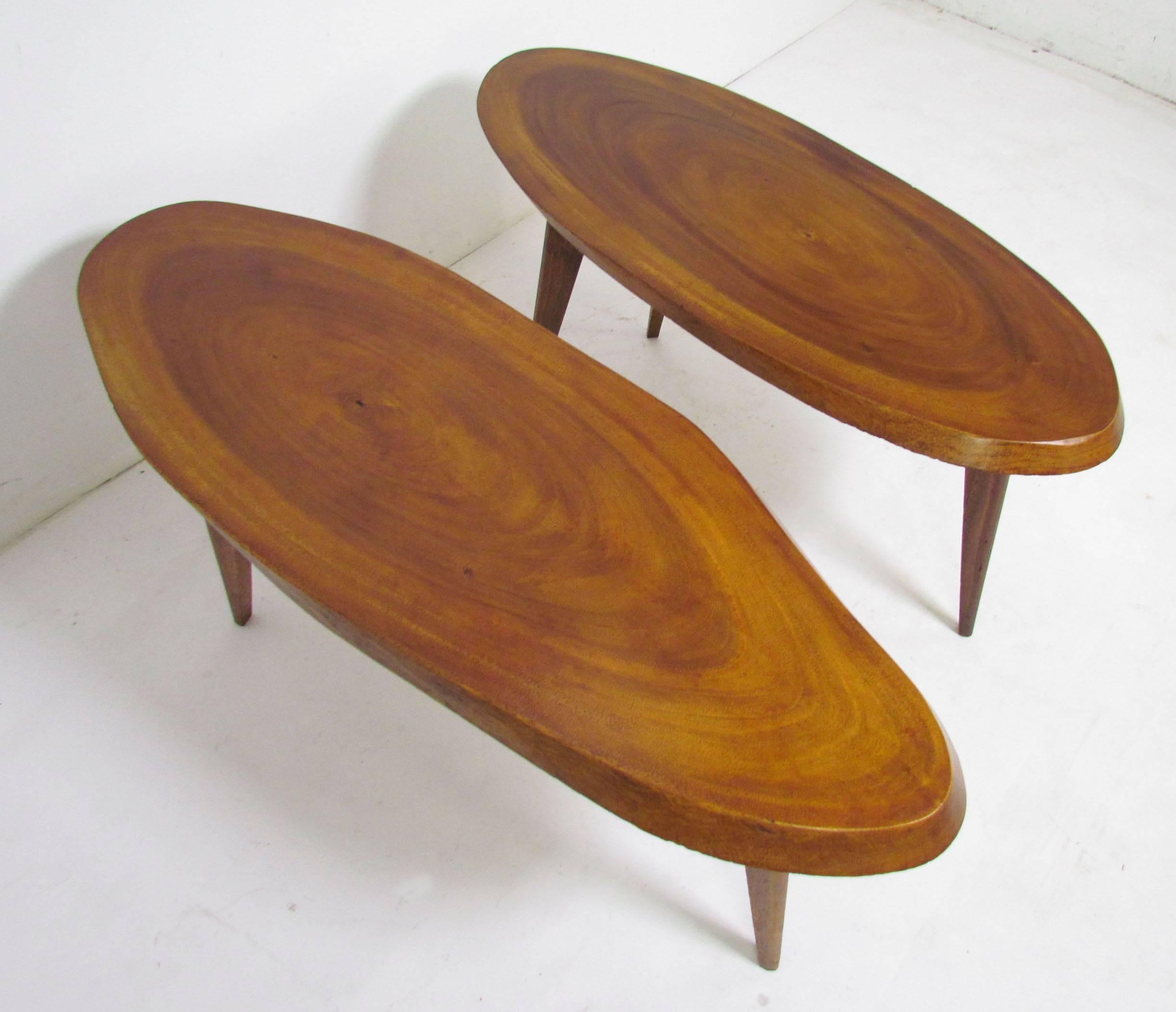 Pair of Mid-Century studio made free-form live edge tables on tripod legs. These function well as side or end tables but could also serve as small coffee or cocktail tables. 

Unknown maker, style reminiscent of George Nakashima.

One measures