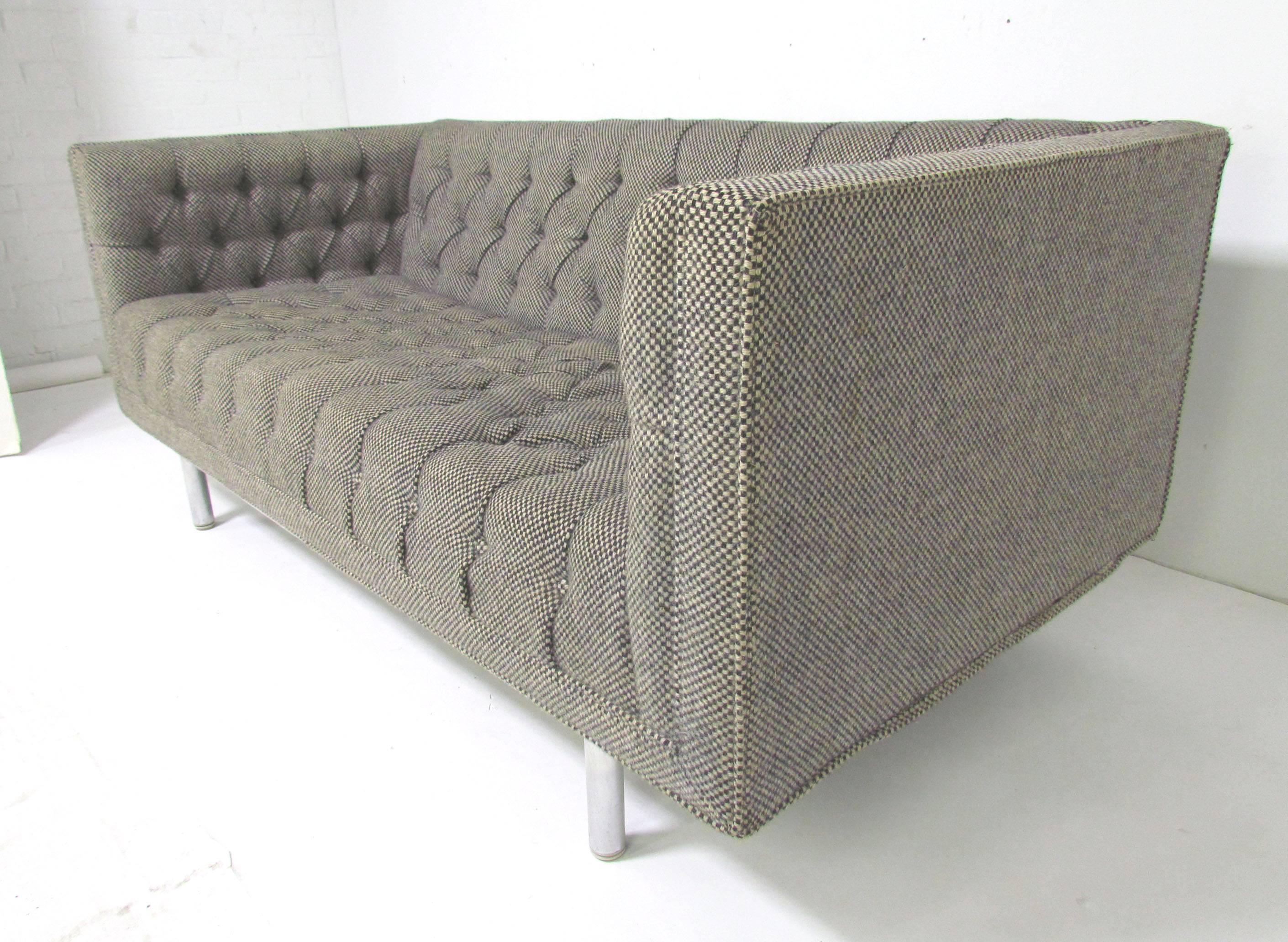 Jack Cartwright tufted tuxedo settee in original hounds tooth wool upholstery and polished aluminum base. Signed, and dated March 1972.