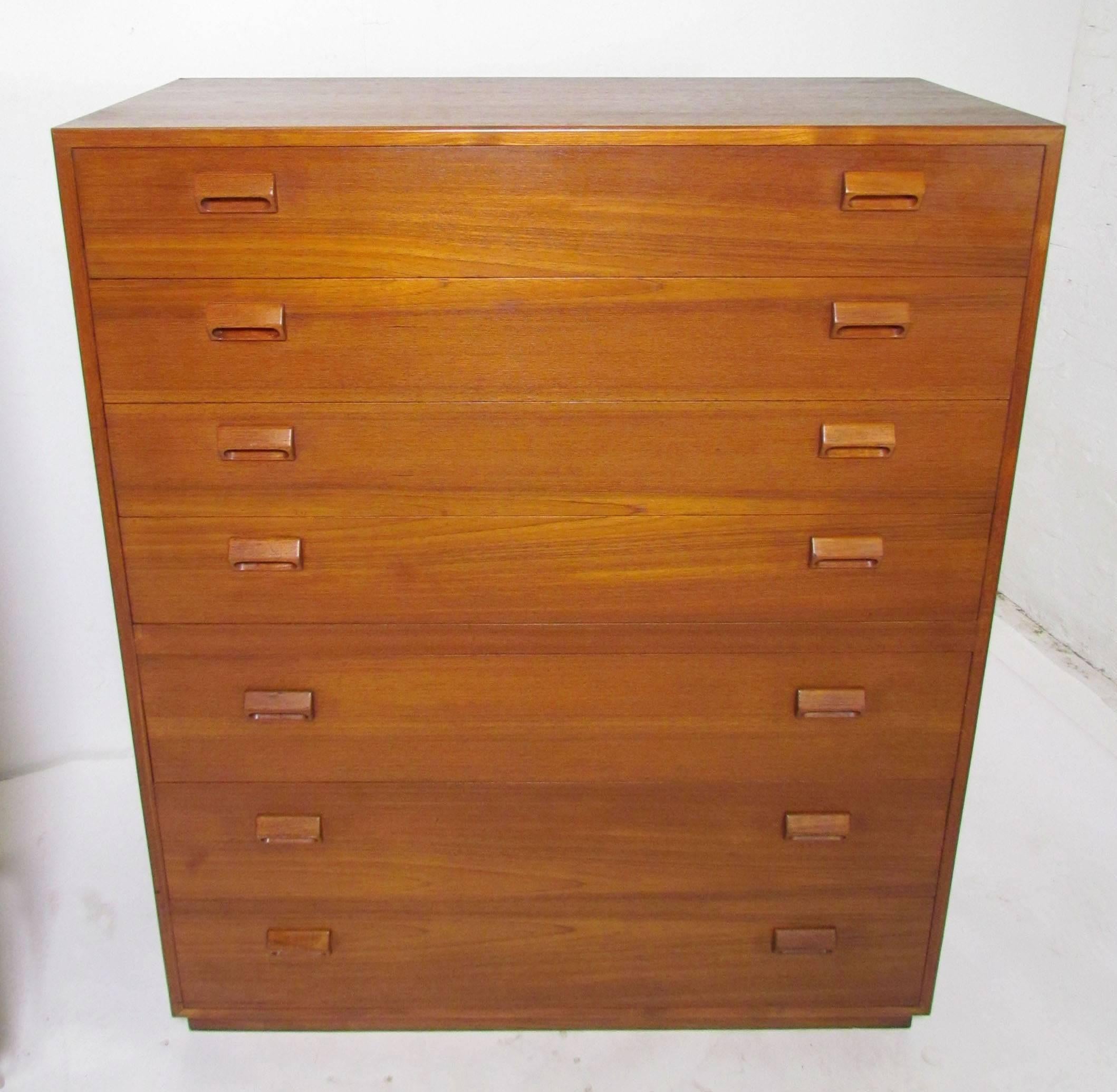 Danish teak highboy seven-drawer chest of drawers by Børge Mogensen for Soborg Mobelfabrik, circa 1960s. Rich patina and Mogensen's signature carved block pulls.

Please note we currently have two of these chests, both from the same estate, but