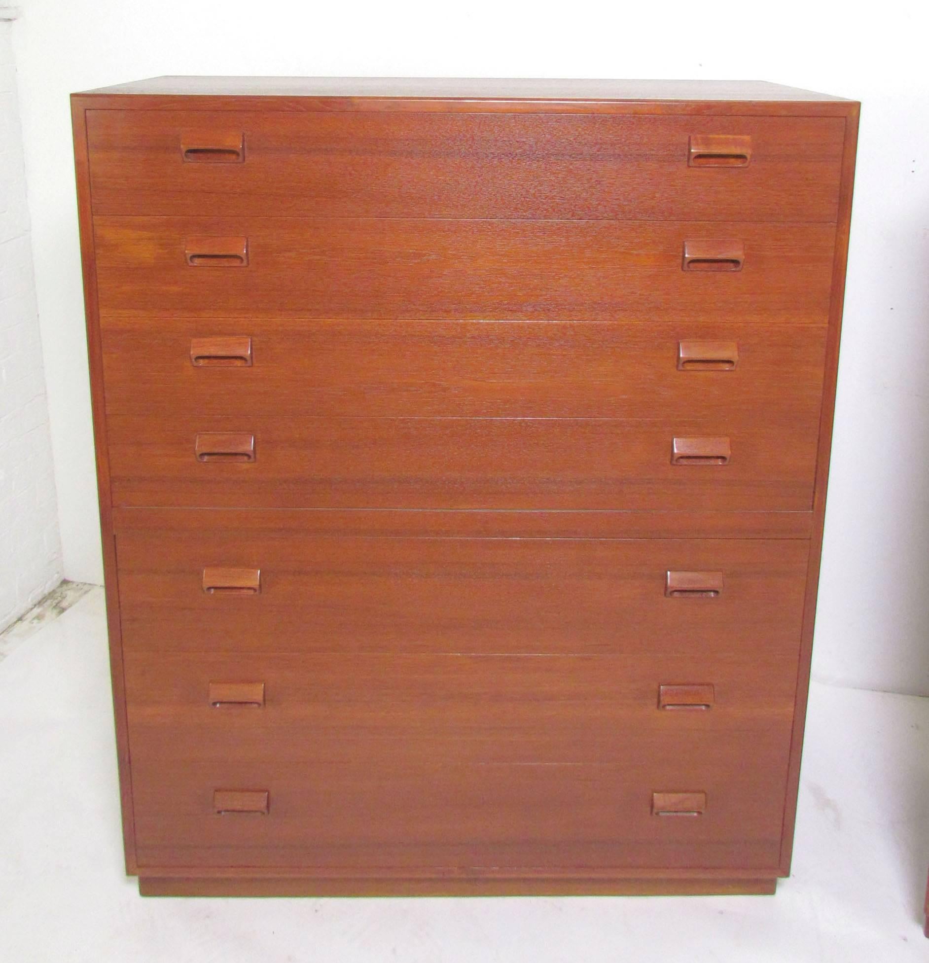 Danish teak highboy seven-drawer chest of drawers by Borge Mogensen for Soborg Mobelfabrik, circa 1960s. Rich patina, and Mogensen's signature carved block pulls.

Please note we currently have two of these chests, both from the same estate, but